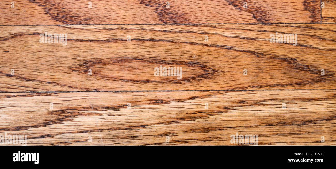 wide crop of old worn and scratched wooden floor background Stock Photo