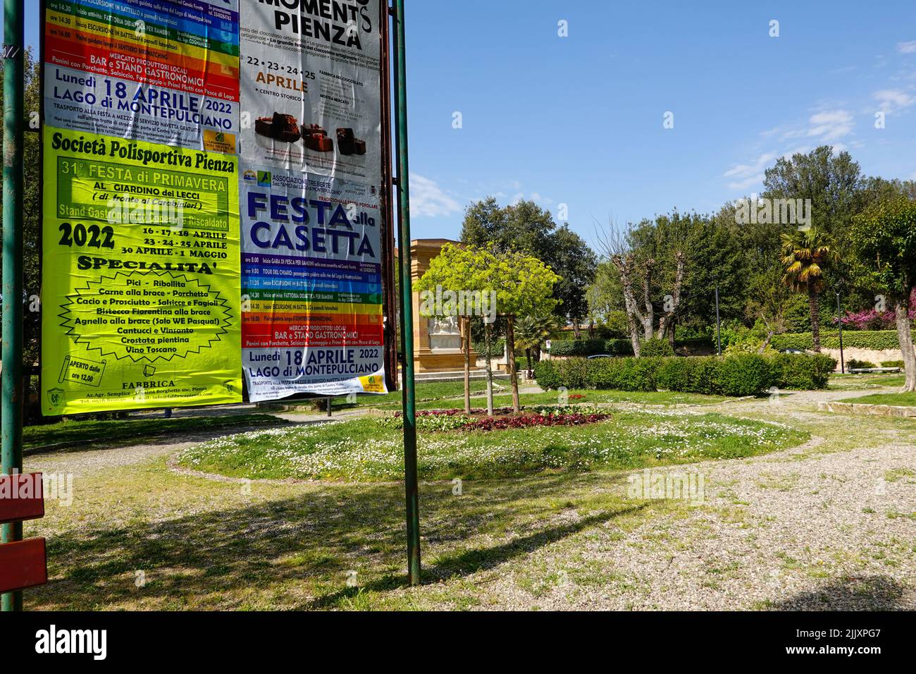 Sign in the central park advertising spring events in Pienza, Italy and the surrounding Tuscan area. Stock Photo