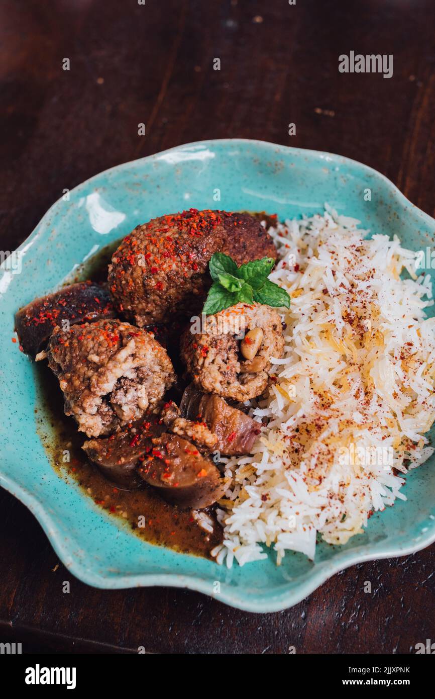 Kibbe Summaqiyeh, kibbeh in sumac stock, meatball recipe from Aleppo Stock Photo