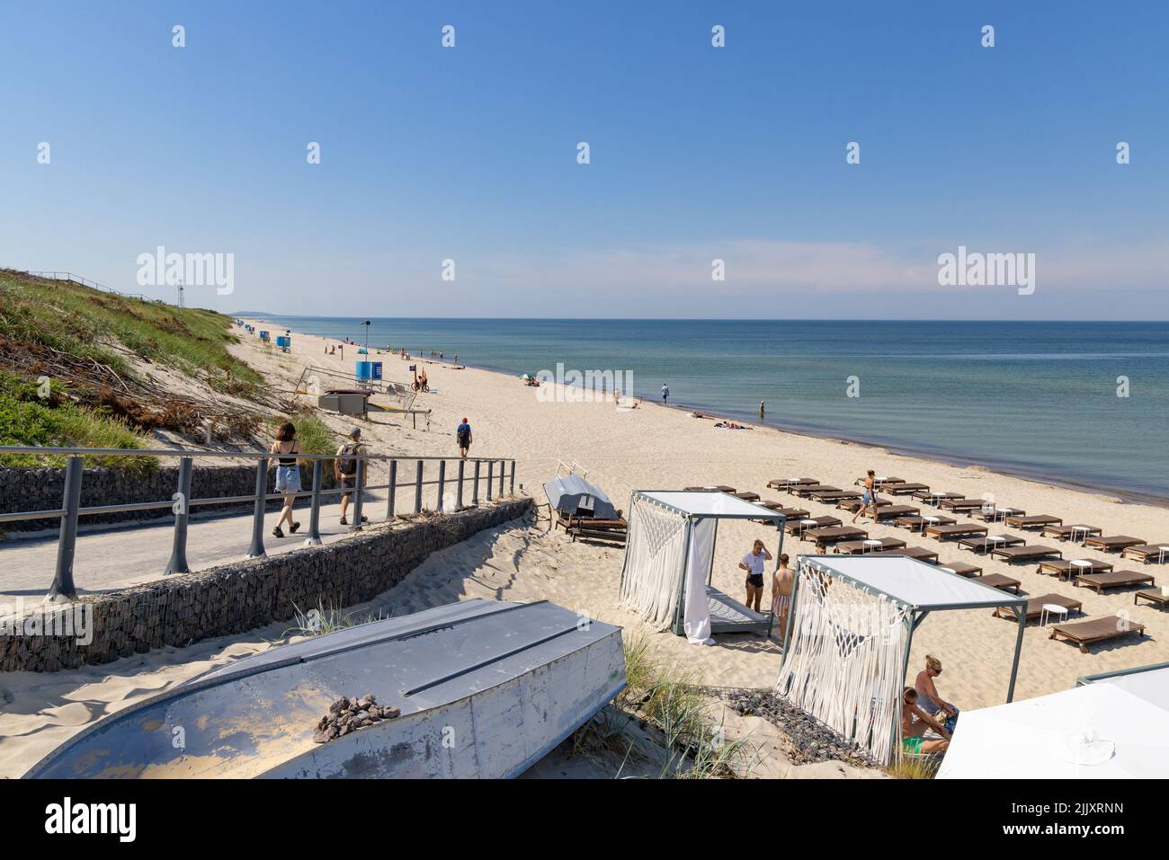 Lithuania beach; people enjoying the sandy beach in summer on the Baltic Sea coast on the Curonian Spit, Lithuania, Europe Stock Photo