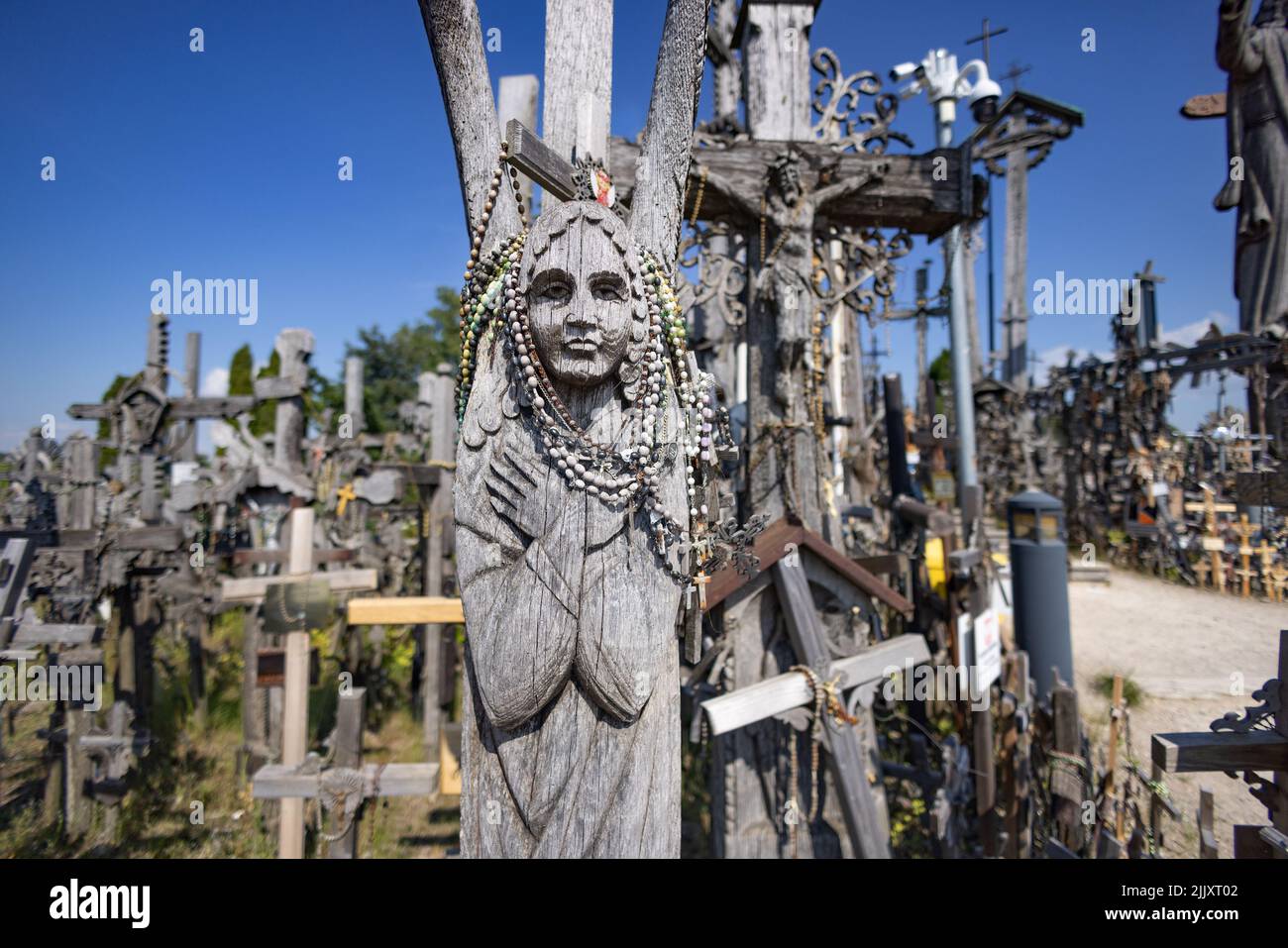 Lithuania culture; Hill of Crosses Lithuania; thousands of carvings and crosses on a hillside, a site of religious pilgrimage, Lithuania Europe Stock Photo