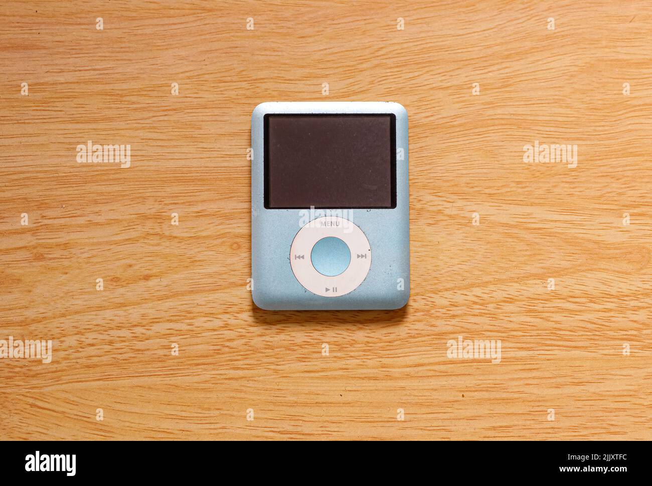 Blue 8gb iPod nano 3rd generation Apple on a wooden background
