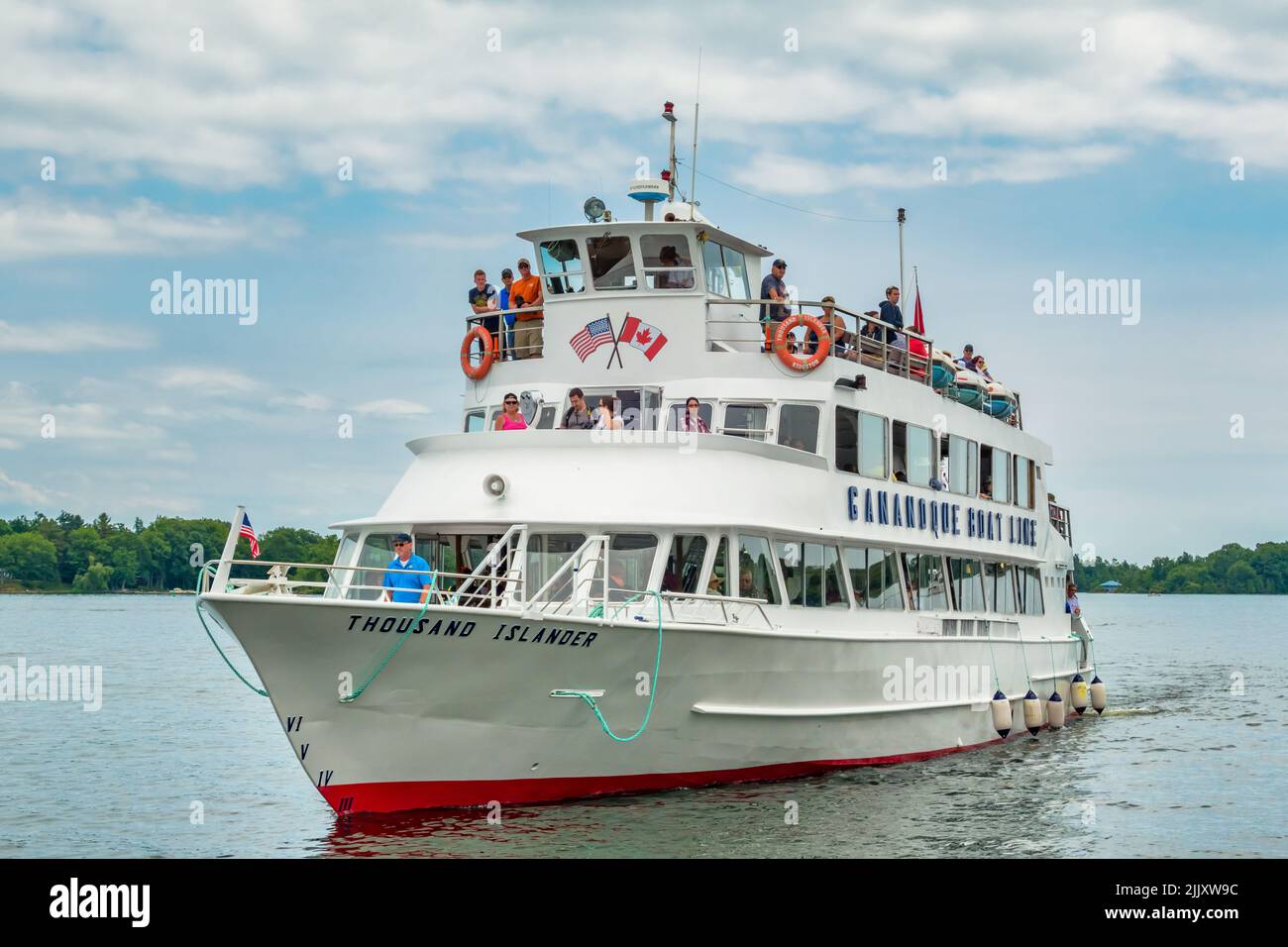 People take part in a Thousand Islands boat tour on the St lawrence River in Gananoque, Ontario, Canada Stock Photo