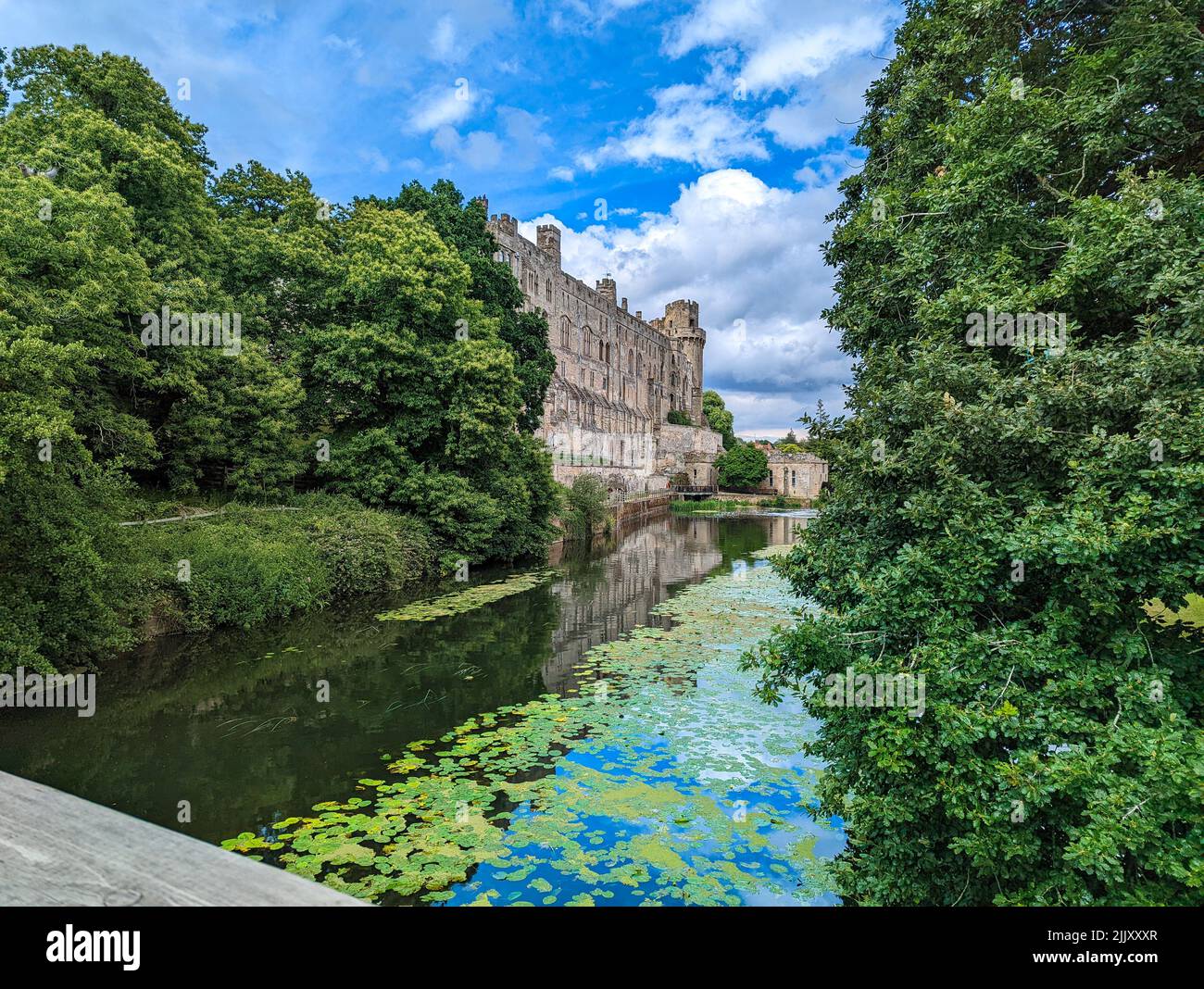 Warwick Castle s a medieval castle original built by William the Conqueror in 1068. View on the Medieval castle along the River Avon, Warwick, Warwick Stock Photo