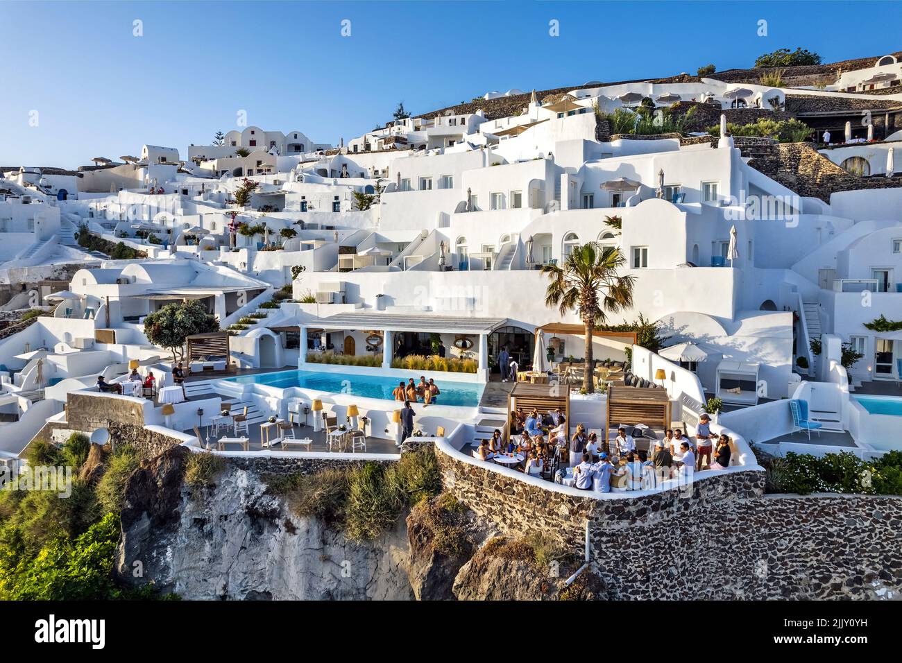 'Katikies Kirini' hotel, 'hangine over the caldera, Perivolas, Oia village, Santorini island, Cyclades, Greece. Stock Photo