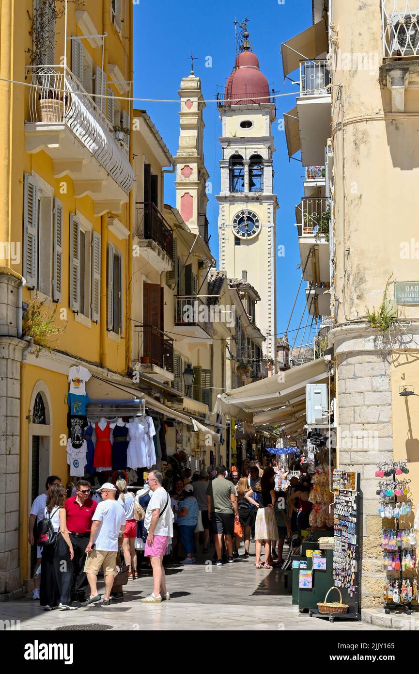 Corfu, Greece - June 2022: Tourists in one of the narrow streets of shops in the old part of Corfu town Stock Photo