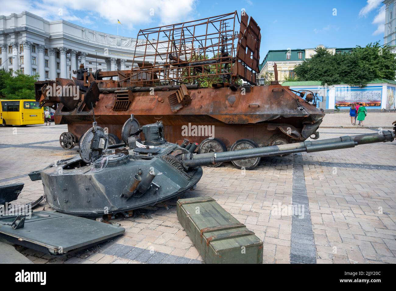 Kiew, Ukraine. 25th July, 2022. On Michael Square in the city center there is a destroyed Russian tank. in front of it there is a turret of an armored personnel carrier. Credit: Christophe Gateau/dpa/Alamy Live News Stock Photo