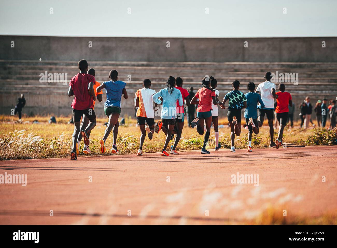 Kenyan marathon runners training at the athletics track in the town of Eldoret near Iten, the center of world endurance running. Preparation in Kenya Stock Photo