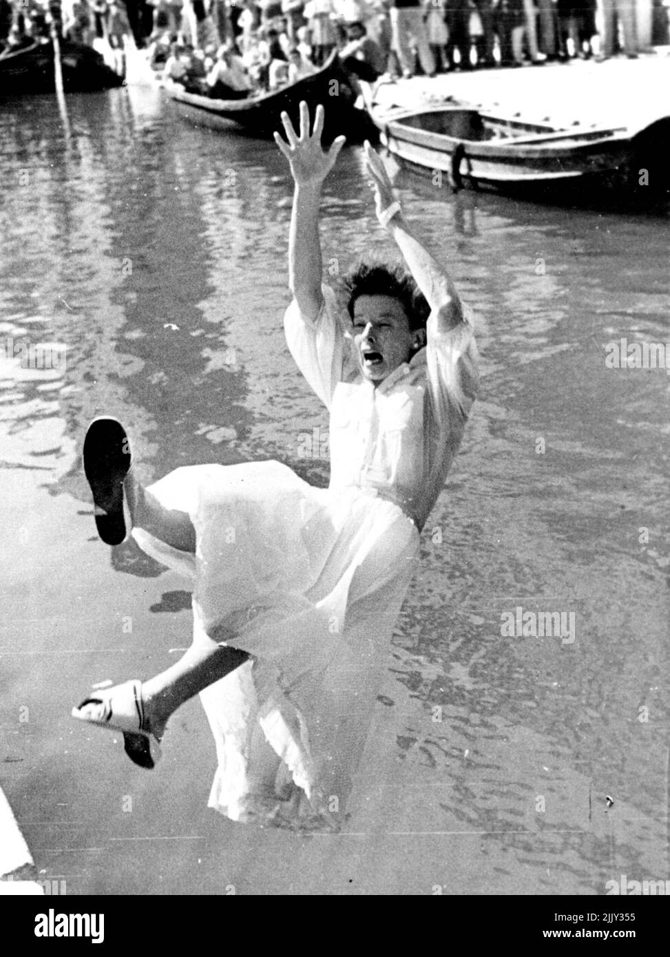 Taking photos Katharine Hepburn steps back & makes graceless ***** into equal. January 18, 1955. (Photo by Look Magazine). Stock Photo
