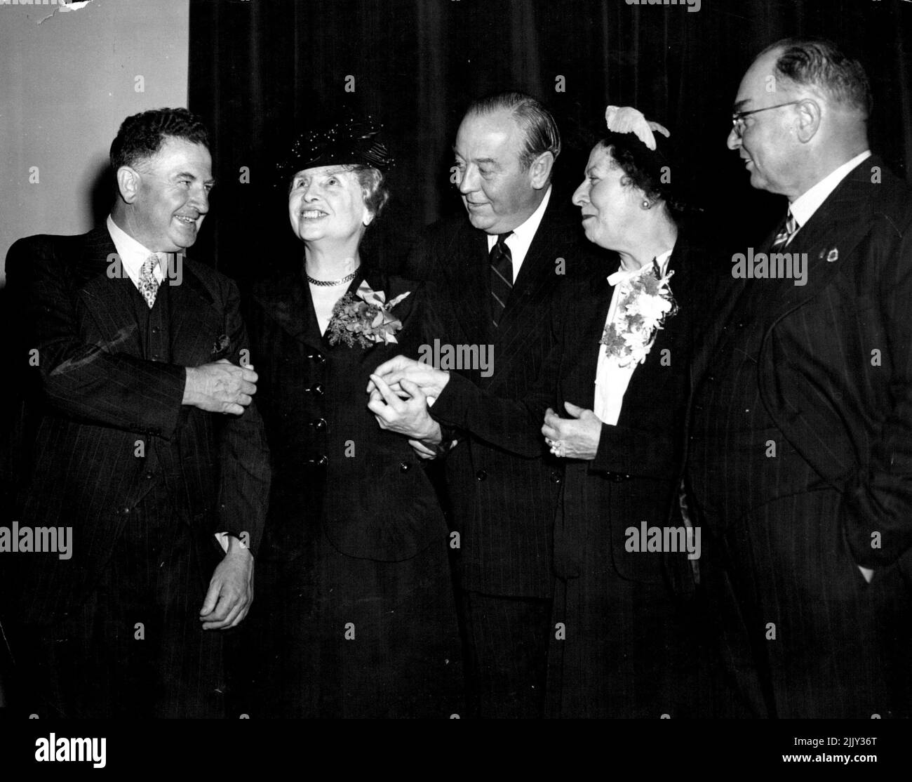 Miss Helen Keller visiting American blind and deaf authoress was given a civic reception by the Lord Mayor at the Town Hall today. Miss Keller being introduced to Lord Mayors from three different states. L to r. Ald Bartley Lord Mayor Sydney. Miss Helen Keller, Sir Raymond Connelly Lord Mayor Melbourne, Miss Polly Thompson, Mr John McLedy Lord Mayor Adelaide. March 31, 1948. (Photo by Ernest Charles Bowen/Fairfax Media). Stock Photo