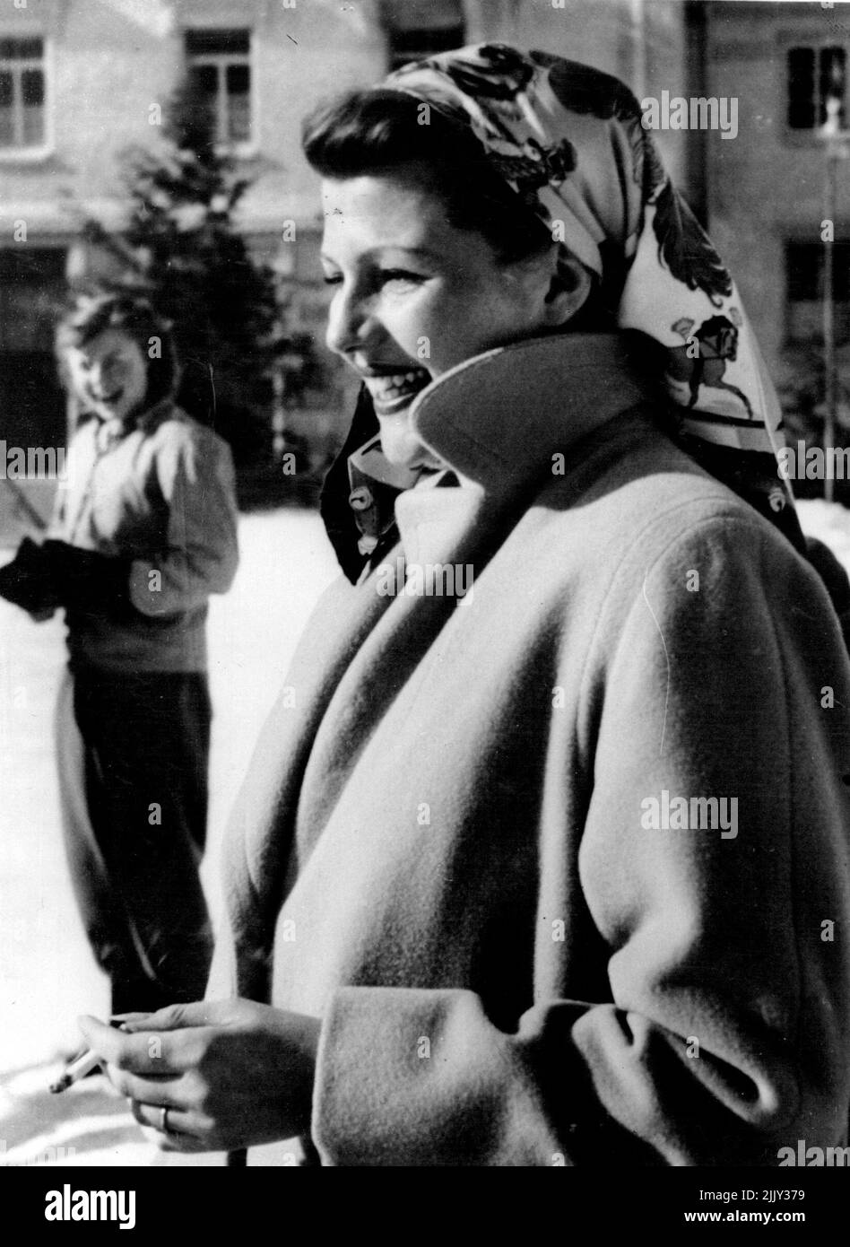 Rita Up And About Again - This exclusive picture, the first to be taken since she left the nursing home after the birth of her baby, Yasmin, shows Rita Hayworth, film actress wife of Prince Aly Khan, at the Palace Ice Rink here. Rita smoked a cigarette while she watched her other daughter, Rebecca, take her first steps on the ice. January 29, 1950. Stock Photo