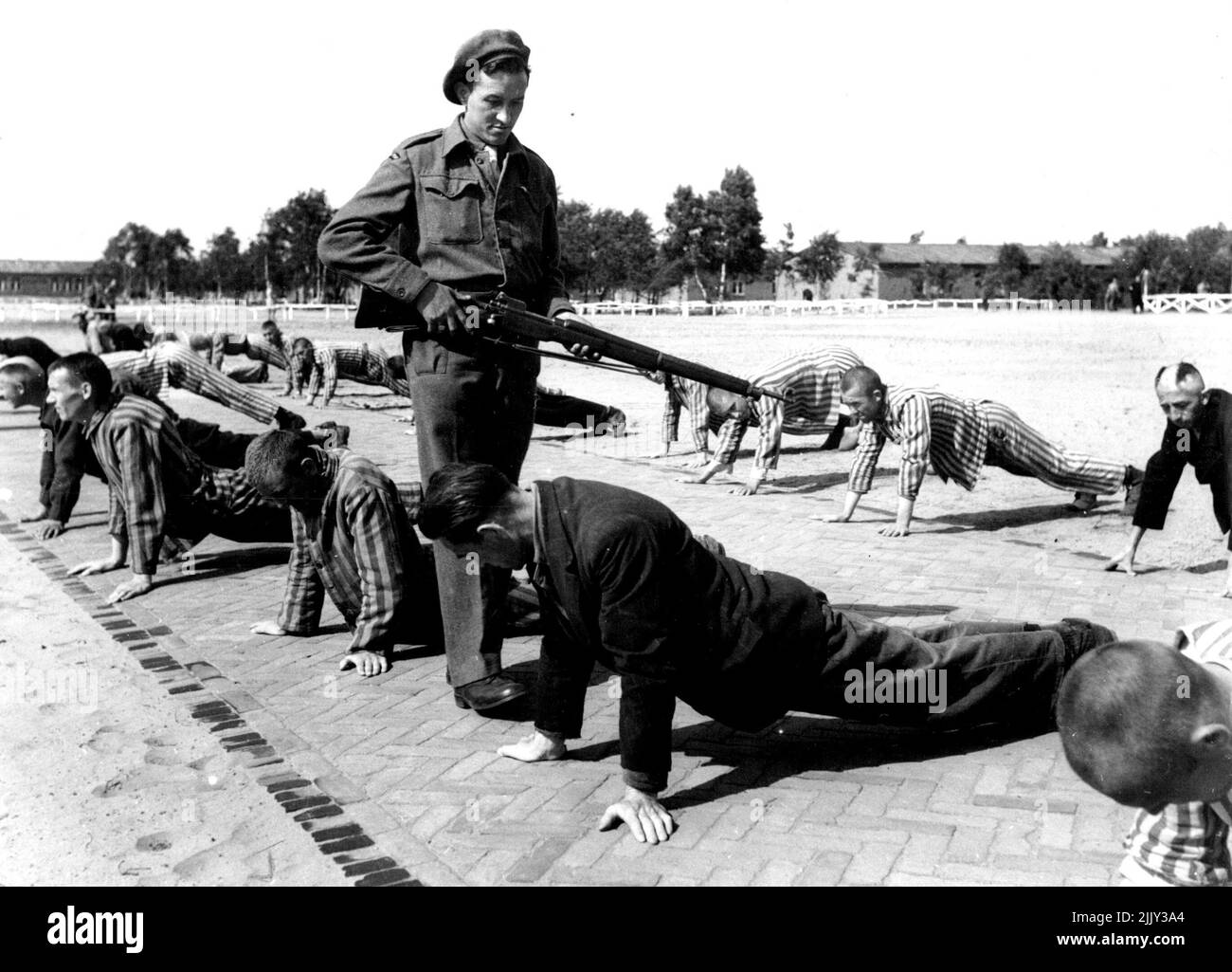 A soldier of the Netherland forces who has been an unwilling prisoner in the concentration camp, discoveres a Dutch Waffen S.S. man who was a guard during the German occupation. After the notorious concentration-camp Vught (in the Southern part of the Netherlands) had been liberated by the allied arrives, it has become a camp for Dutch collaborators are now in that camp. 300 Belong to the 'Netherlands Waffen S.S.' They are dressed in the same prisonsuits as formerly the underground resistant members were put-in after ***** been transported to Vught. June 01, 1945. (Photo by Anefo). Stock Photo