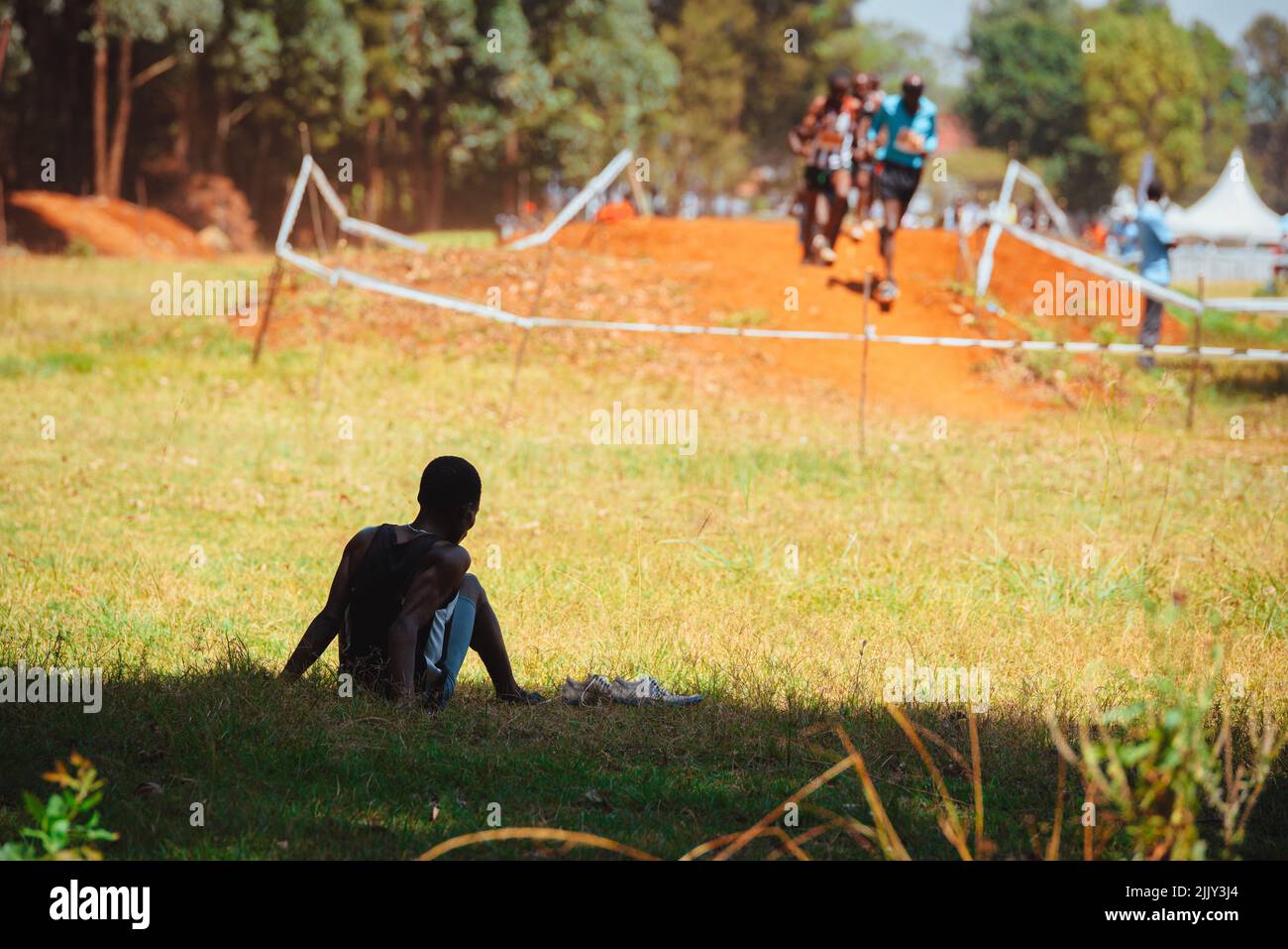 The runner withdrew from the race. He has given up and is not continuing his run. Stock Photo