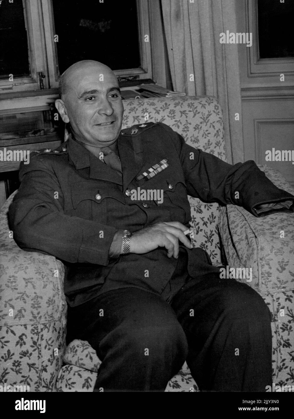 l Popski) in his Mayfair flat today Nov. 5th 1946. He lost his left arm in Sept 1944 North of Ravenna. Lt. Col. Vladimir Peniakoff aged 49 leader of a famous little band of men known as 'Popski's' private army has arrived in London where he has described the adventures of the British adding force which operated behind the enemy lines in Africa and Italy. The Colonel was born in Belgium and is here to be released from the army. His knowledge of the desert and his command of Arabic led to his joining the British forces in the Western Desert. November 5, 1946. (Photo by The Associated Press Ltd.) Stock Photo