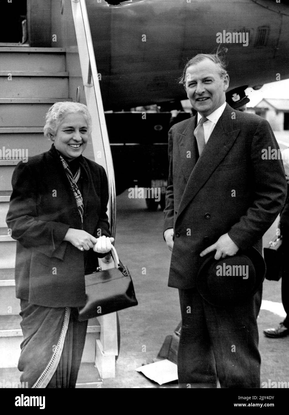 ere On Official Visit To See The Queen -- Mrs. Laxshmi Pandit Sister of Indian Prime Minister Nehru and President of United Nations General Assembly pictured with Mr. Selwyn Lloyd, Minister of State, Foreign Office who greeted by Swissair liner from Geneva today (Monday). Mrs. Pandit, who is soon to be India's High Commissioner to Britain is her on an official five-day visit as President of the General Assembly she is to have an audience with the Queen at Buckingham Palace tomorrow. After the official visit she will spend a further 10 days here privately. July 05, 1954. (Photo by Reuterphoto). Stock Photo