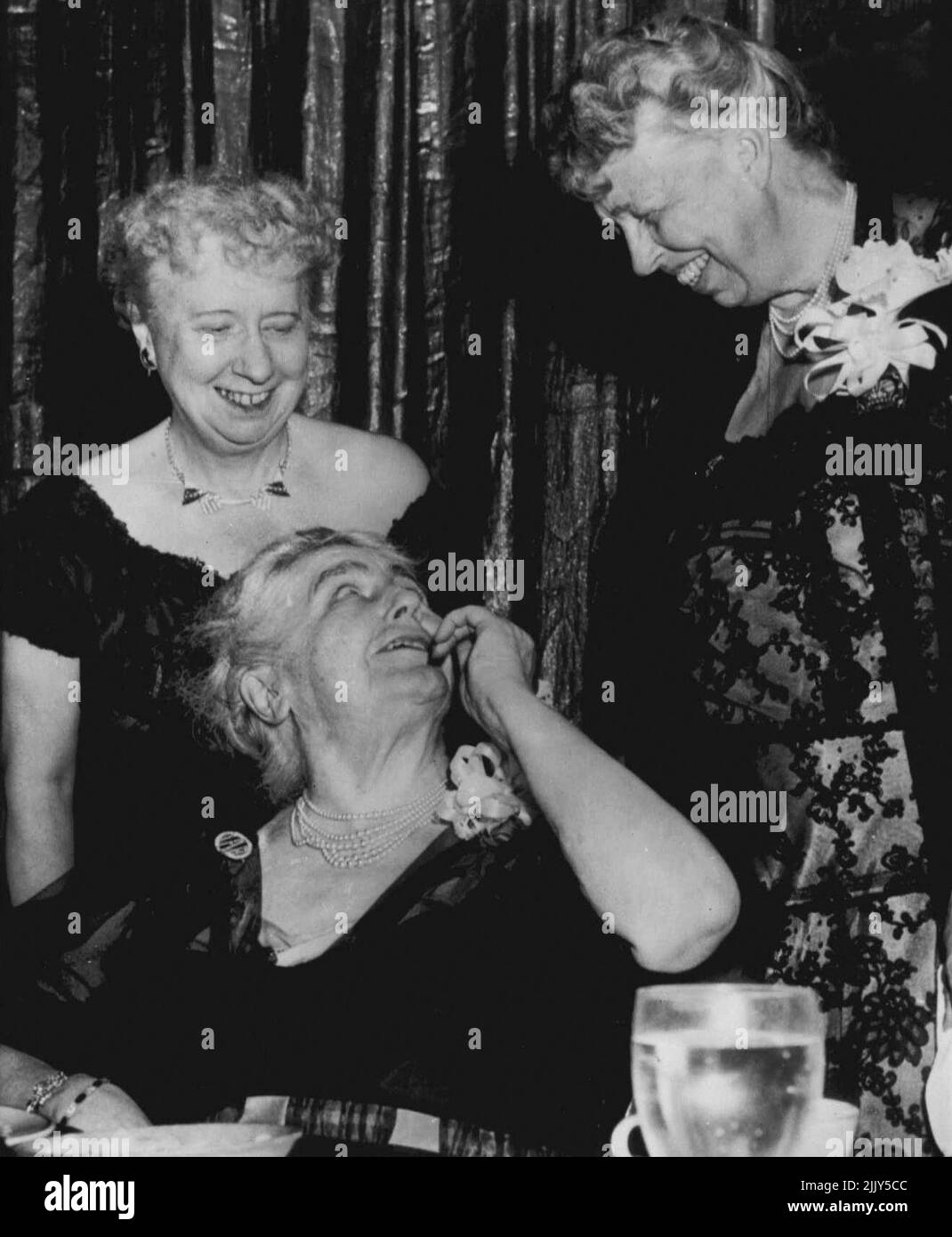 Former First Ladies Get Together - Mrs. Woodrow Wilson looks up as she has word tonight with two other former first ladies of the land, Mrs. Harry Truman, left and Mrs. Franklin D. Roosevelt, at the gathering of top Democrats attending the testimonial dinner for house Speaker Sam Raybirn (D-Tex). April 16, 1955. (Photo by AP Wirephoto). Stock Photo