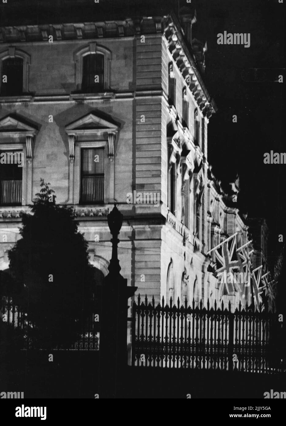Brisbane ***** celebrations corner parliament house flood with lights. June 12, 1946. Stock Photo