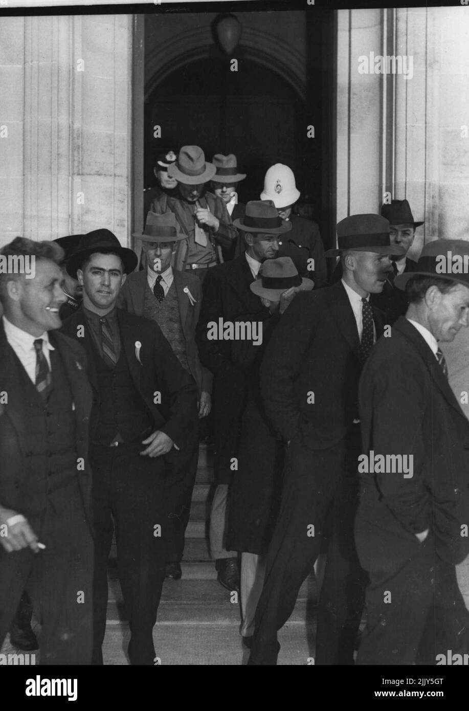 Raid on Parlt. House, Brisbane, August 4. The raiders leaving Parlt. House under arrest. August 15, 1939. Stock Photo