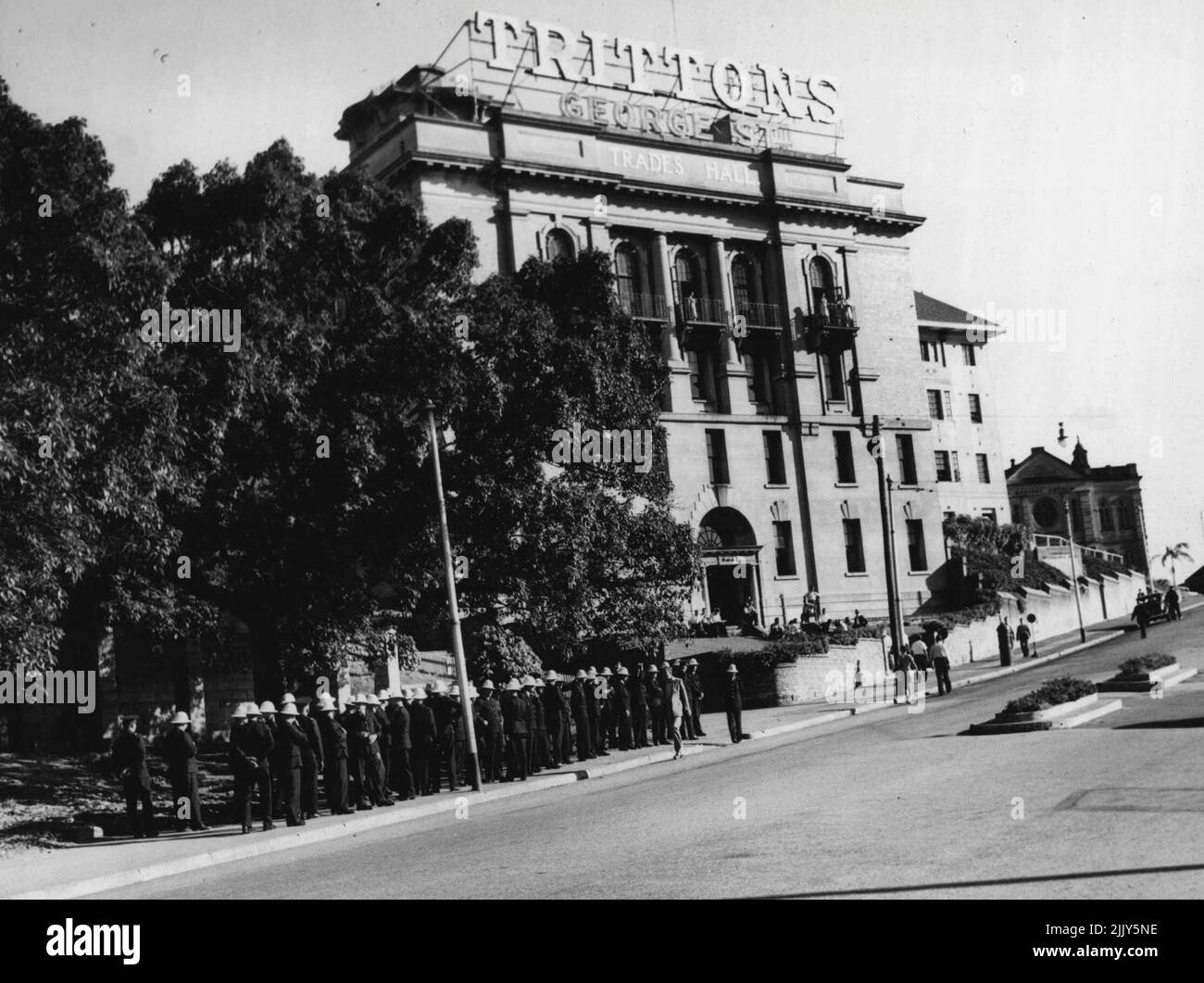 Police massed outside the Trades Hall Brisbane to meet ***** emergency. Shows forces were also posted in the vicinity of Wednesday's disturbance. March 18, 1948. (Photo by The Telegraph Feature Service). Stock Photo