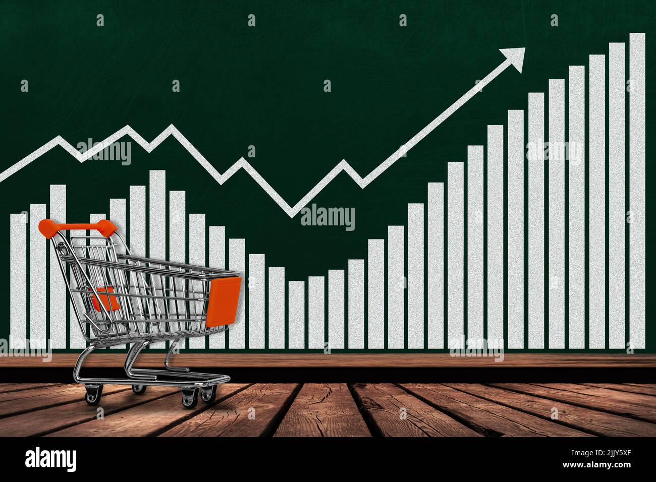 Shopping cart and growth chart on chalkboard with copy space. Concept of increases in sales, revenues, profits, economy, inflation, business activity. Stock Photo