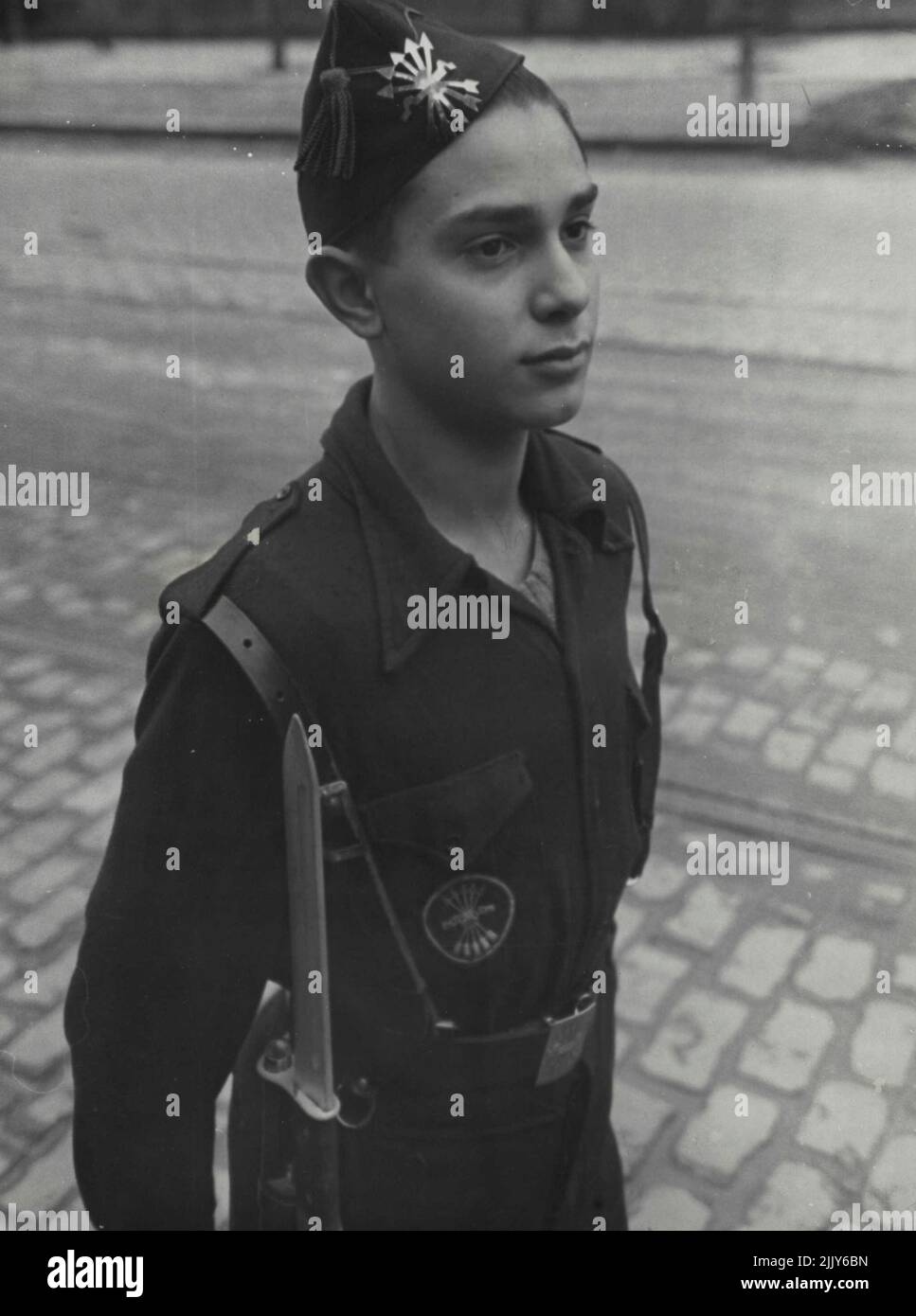 A member of the Falange youth. Like the Ballila in Italy they carry dummy rifles. August 29, 1951. (Photo by Black Star). Stock Photo