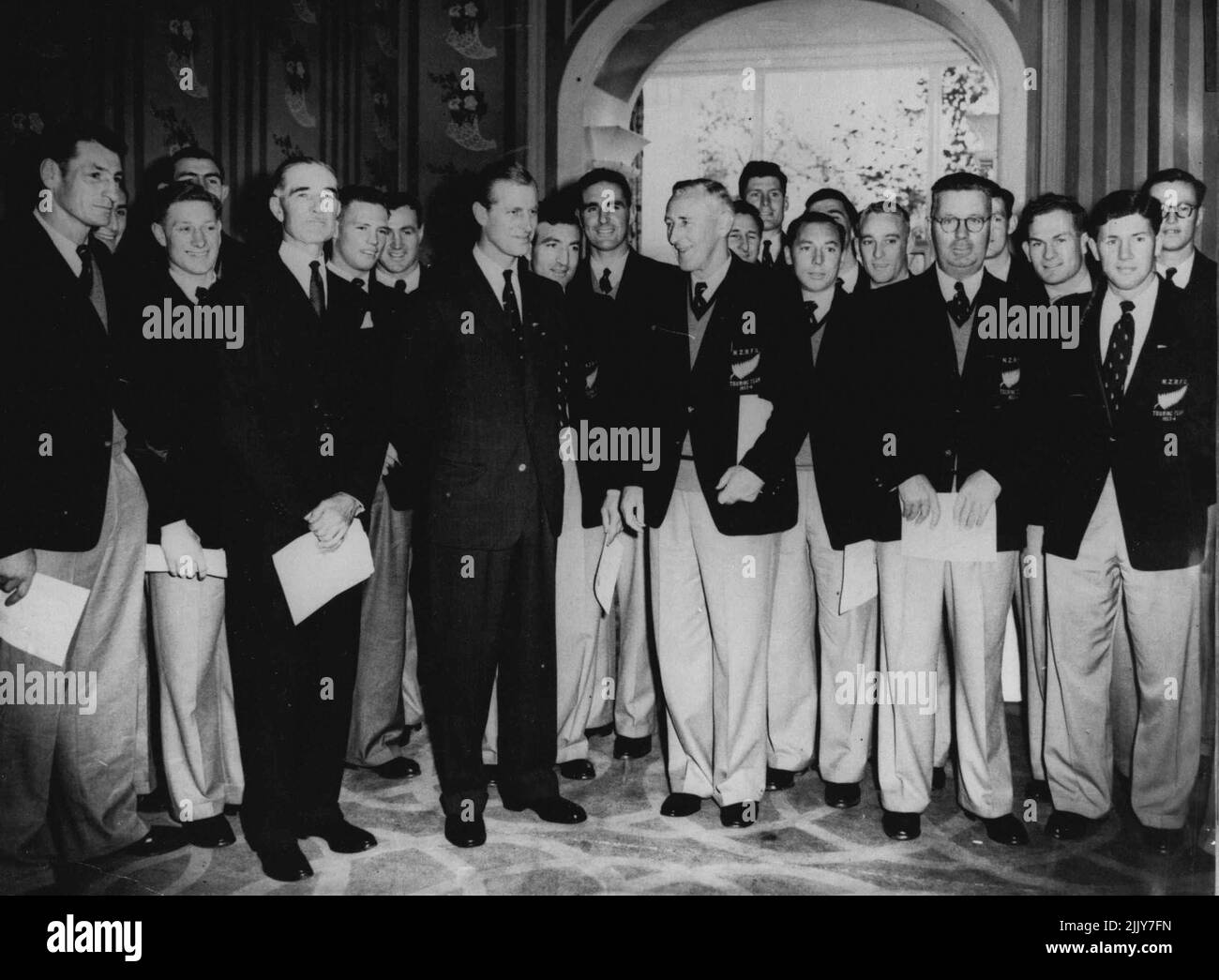 Duke Lunches With The All Blacks -- The Duke of Edinburgh with members of the New Zealand touring rugby team (All Blacks), is seen (third from left, front row), at the Savoy Hotel, London, today November 3rd, when he attended a luncheon given for the New Zealand players by the British Sportsman's Club. November 03, 1953. (Photo by Associated Press Photo). Stock Photo