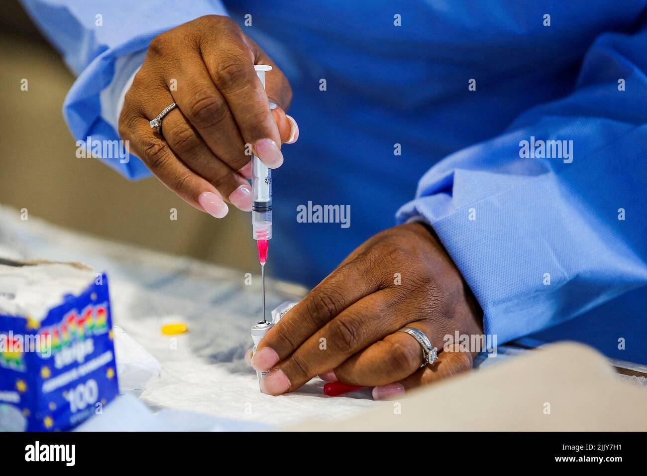 A staff member of the Westchester Medical Center prepares a monkeypox vaccine in a drive-through monkeypox vaccination point at the Westchester Medical Center in Valhalla, New York, U.S., July 28, 2022. REUTERS/Eduardo Munoz Stock Photo