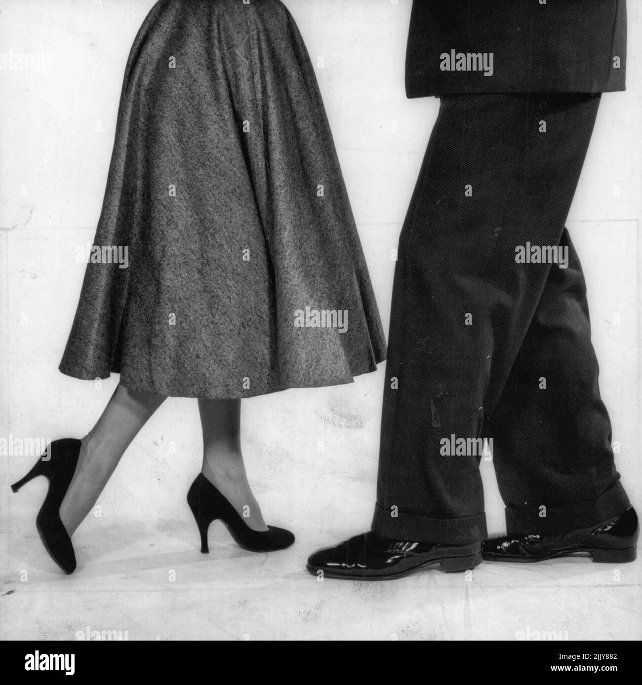 Step Three: Man brings his right foot forward halfway. Girl takes her left foot halfway back. March 18, 1955. Stock Photo