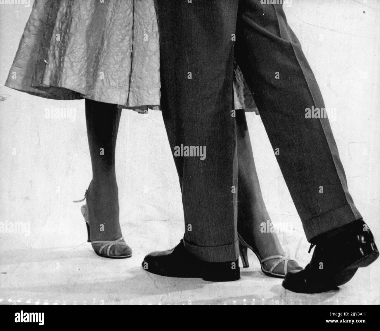 Man moves left foot forward while girl moves her right foot back. (Slow steps take two beats, quick steps one.). March 14, 1955. Stock Photo