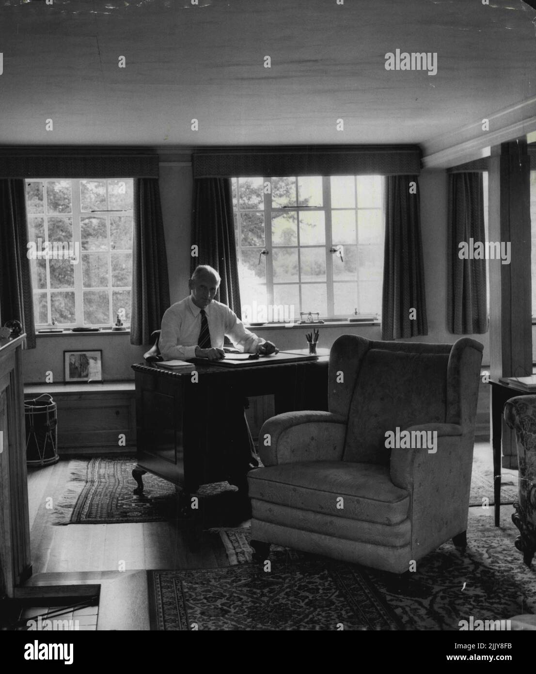 Field Marshal Viscount Montgomery: The Field Marshal at his desk in the drawing room of his converted Mill house home at Isington, Hampshire. Here he answers his personal letters which he insists shall be done in his own handwriting. January 10, 1955. (Photo by Jack Esten). Stock Photo