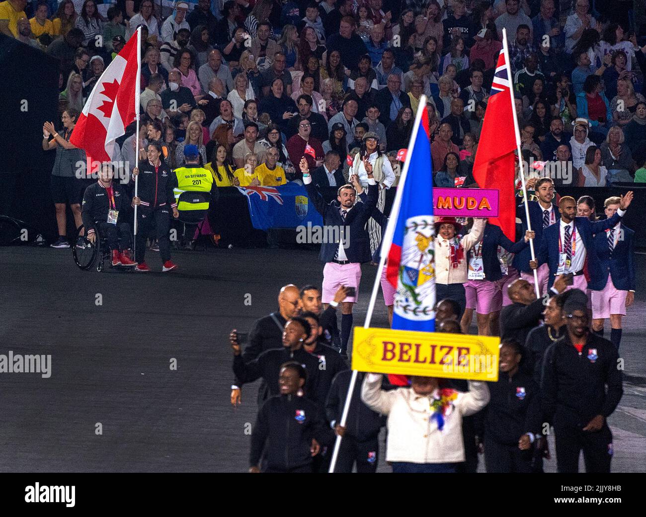 Flag bearers weightlifter Maude Charron and wheelchair racer Josh