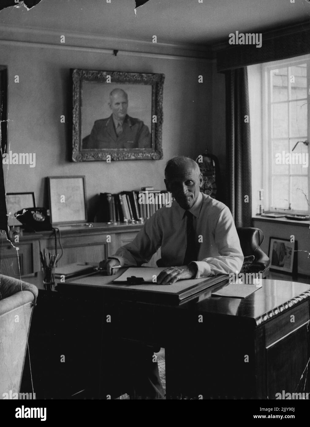 Field Marshal Viscount Montgomery -- The Field Marshal at his desk in the drawing room of his converted Mill house home at Isington, Hampshire. Here he answers his personal letters which he insists shall be done in his own handwriting. January 10, 1955. (Photo by Jack Esten). Stock Photo