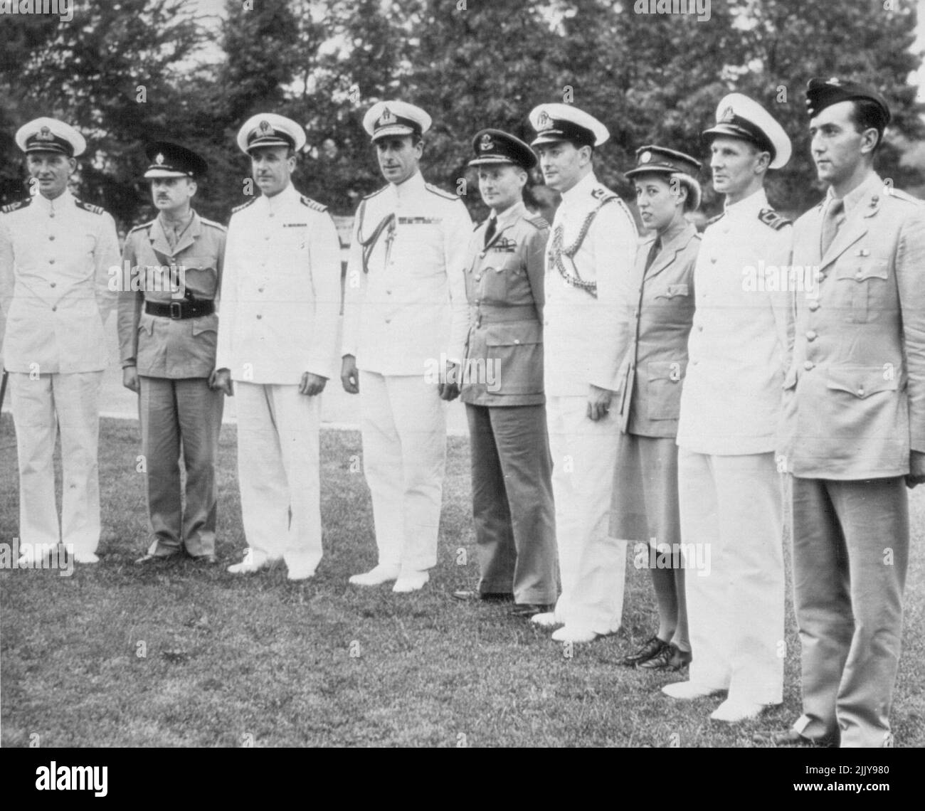 Lord Louis and staff arrive to discuss plans Lord Louis Mountbatten (fourth from left), New Allied Commander fro SouthEast Asia, arrives with staff to visit Adm. Ernest J. King, U.S. Navy Chief, to begin discussions expected to result in final plans for ***** Japs from Burma. (L-R) Lt. Comdr. C.E.H. Batham, R.N., Lt. Col. M.E. *****, Capt. H.D. Tollemache, R.N., Lord Louis , Lt. Comdr. A.E. Levenson, ***** Capt. A.W.F. Merer, Raf; Corp Joy Smith, Ats; Lt. Comdr. C.G.H. *****, and Maj. R.R. Fairbarn. August 26, 1943. (Photo by AP Wirephoto). Stock Photo