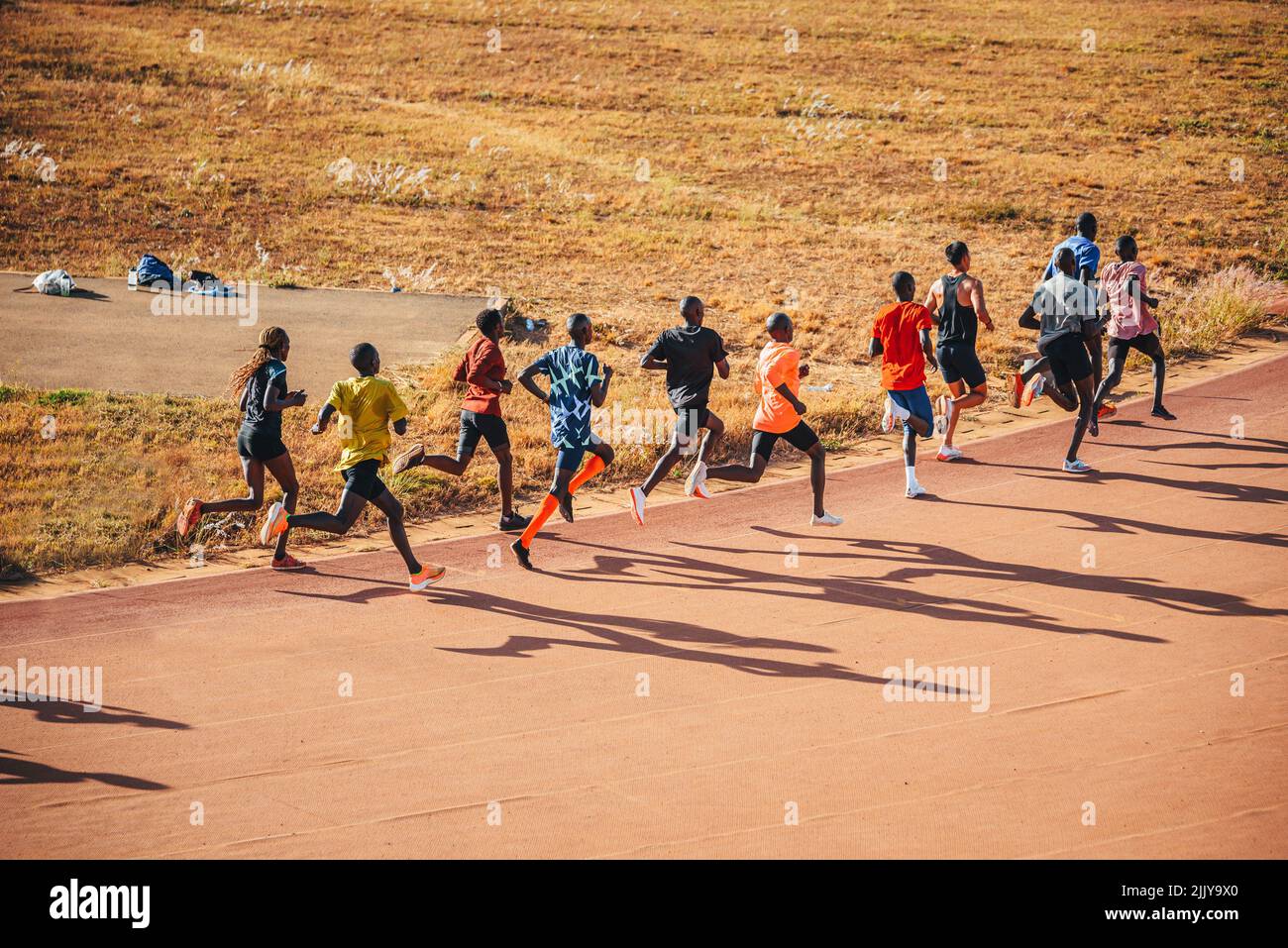 Kenyan marathon runners train at the athletics track in the town of Eldoret near Iten, the