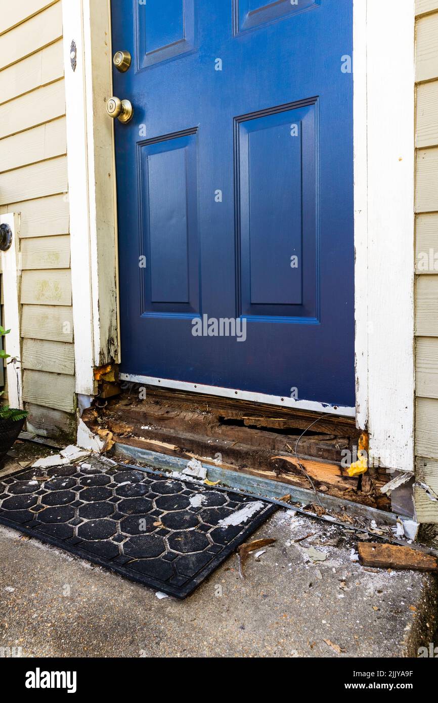 Damaged wood frame of door being repaired Stock Photo
