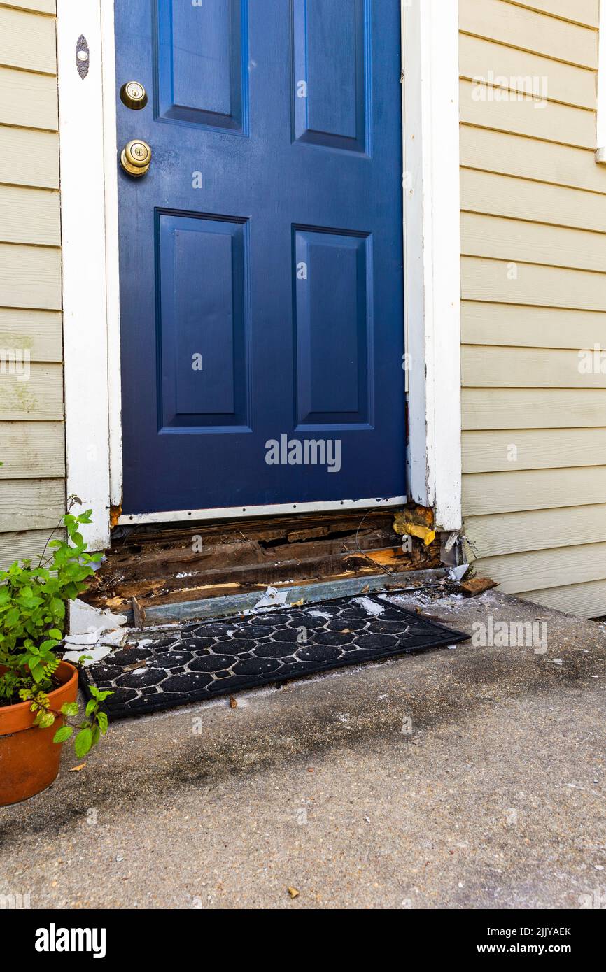 Water damage to wood on door frame of house. Stock Photo