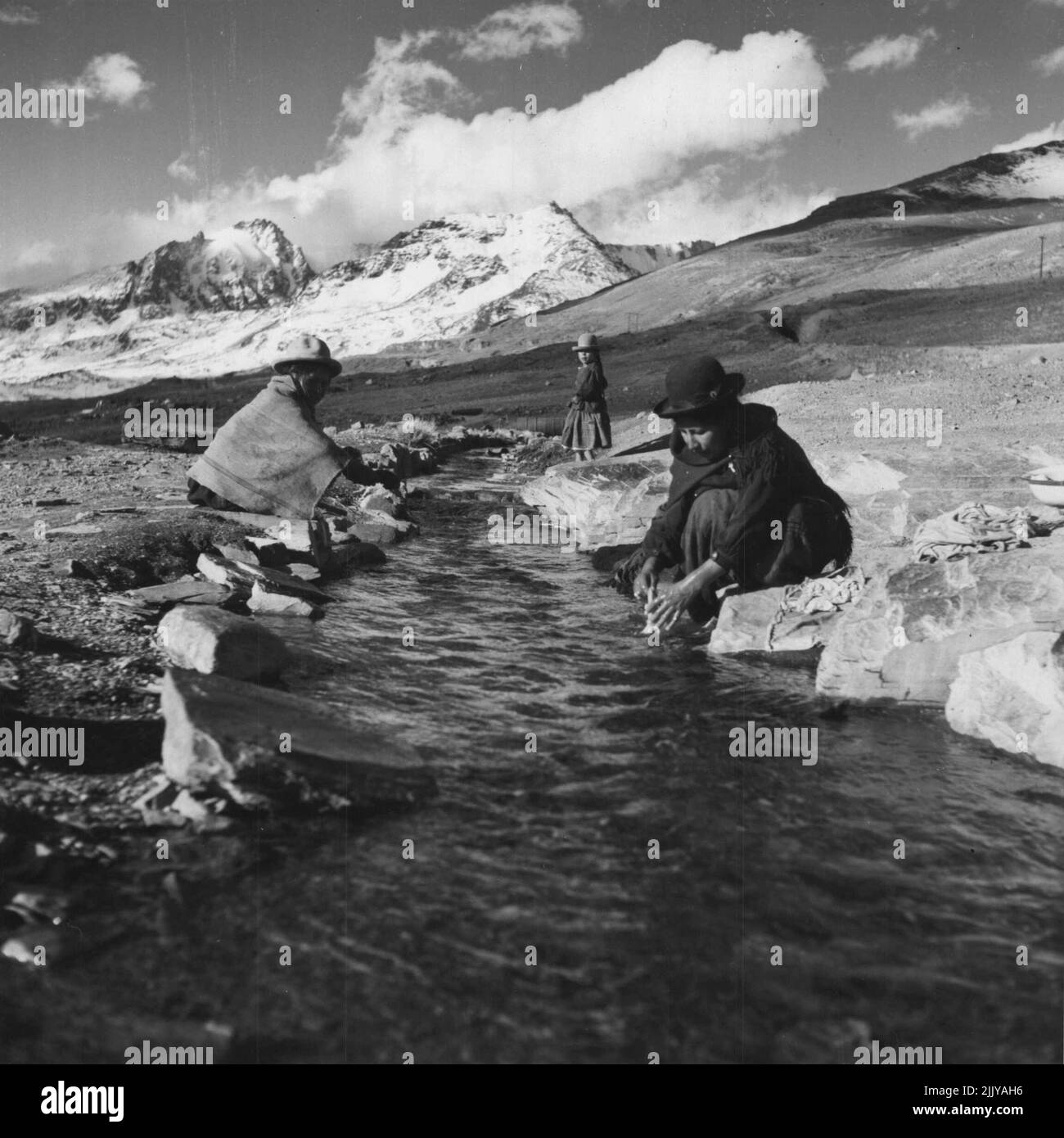 Background Pictures On Bolivia Indian women washing clothes in mountain