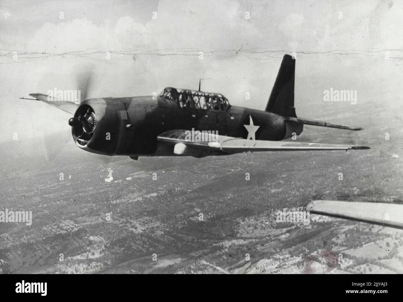 New U.S. Army Dive Bomber -- The A-31, a new U.S. two-seater bomber, is shown in a test flight. Powered by a single air cooled radial engine, it has an unusually long range of operation. The A-31, called the 'Vengeance' by the British, has been in mass production for some time for shipment to United Nations' fighting fronts. February 22, 1943. (Photo by Interphoto News Pictures). Stock Photo