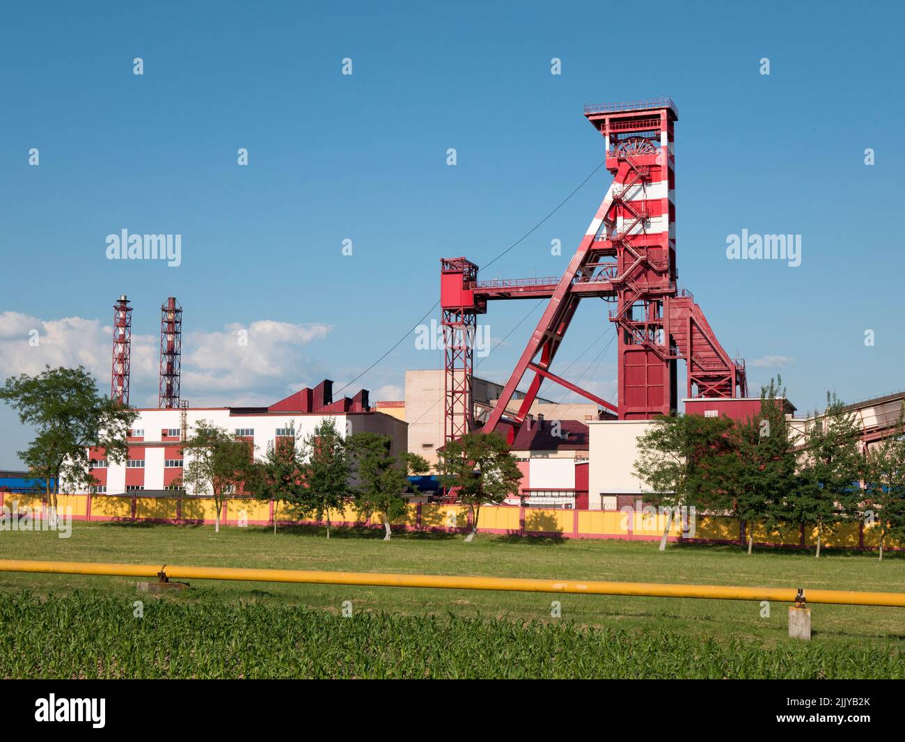 Elevator for raising mineral resources. Mine area with a mine shaft tower, selective focus Stock Photo