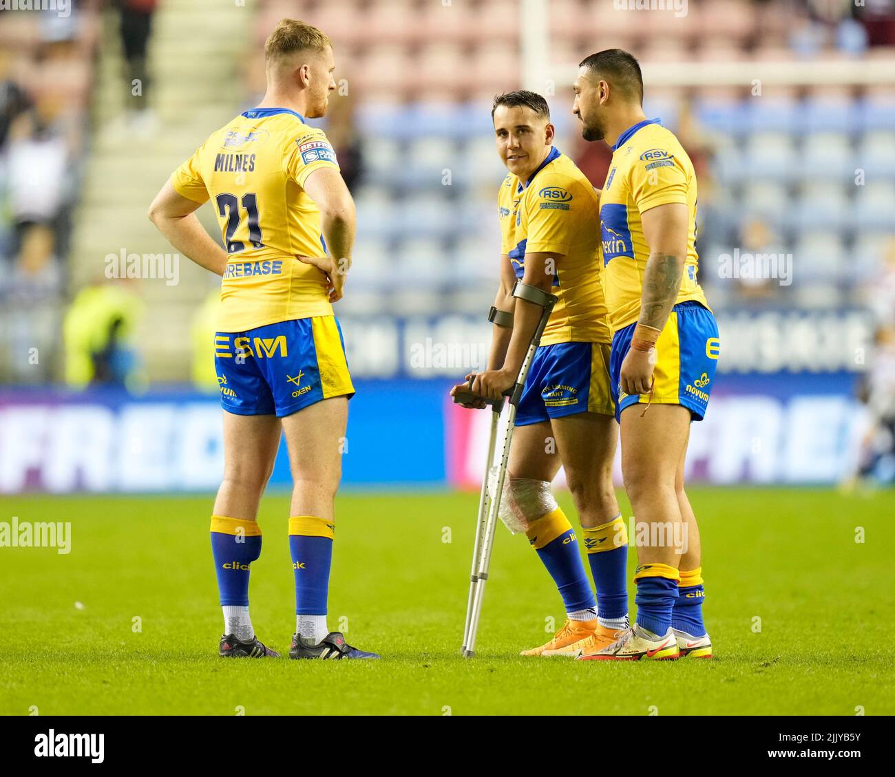 Charlie Cavanaugh #30 of Hull KR is consoled by Elliot Minchella and ...