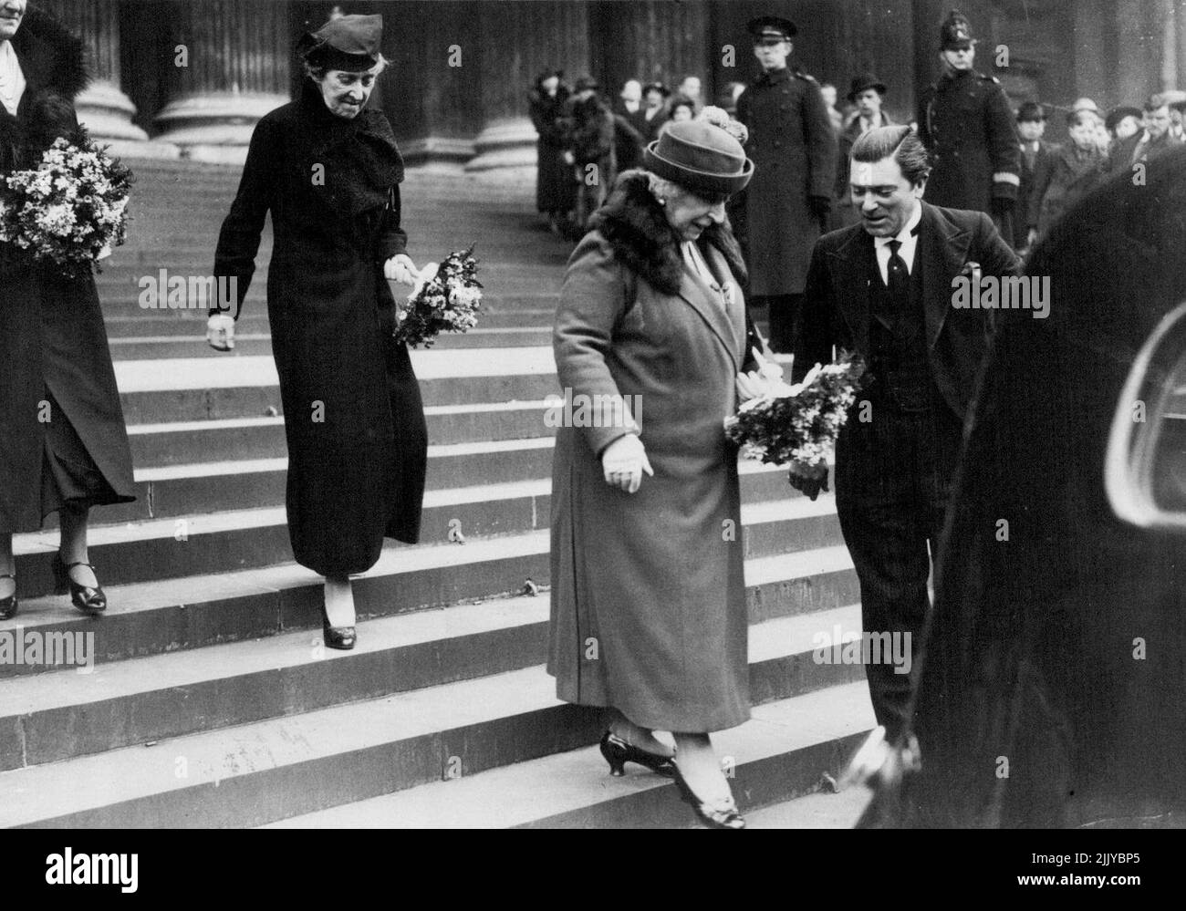 Distribution of Maundy Money At St. Paul's -- Princess Marie Louise (right) and Princess Helena Victoria leaving after the ceremony. The first coins to bear the head of King George VI were specially struck for the Maundy Thursday service held to-day at St. Paul's Cathedral, London. The silver penny, two penny, three penny, and four penny pieces are given to as many old men and women as the King has years of age - 42. March 25, 1937. (Photo by Topical Press). Stock Photo