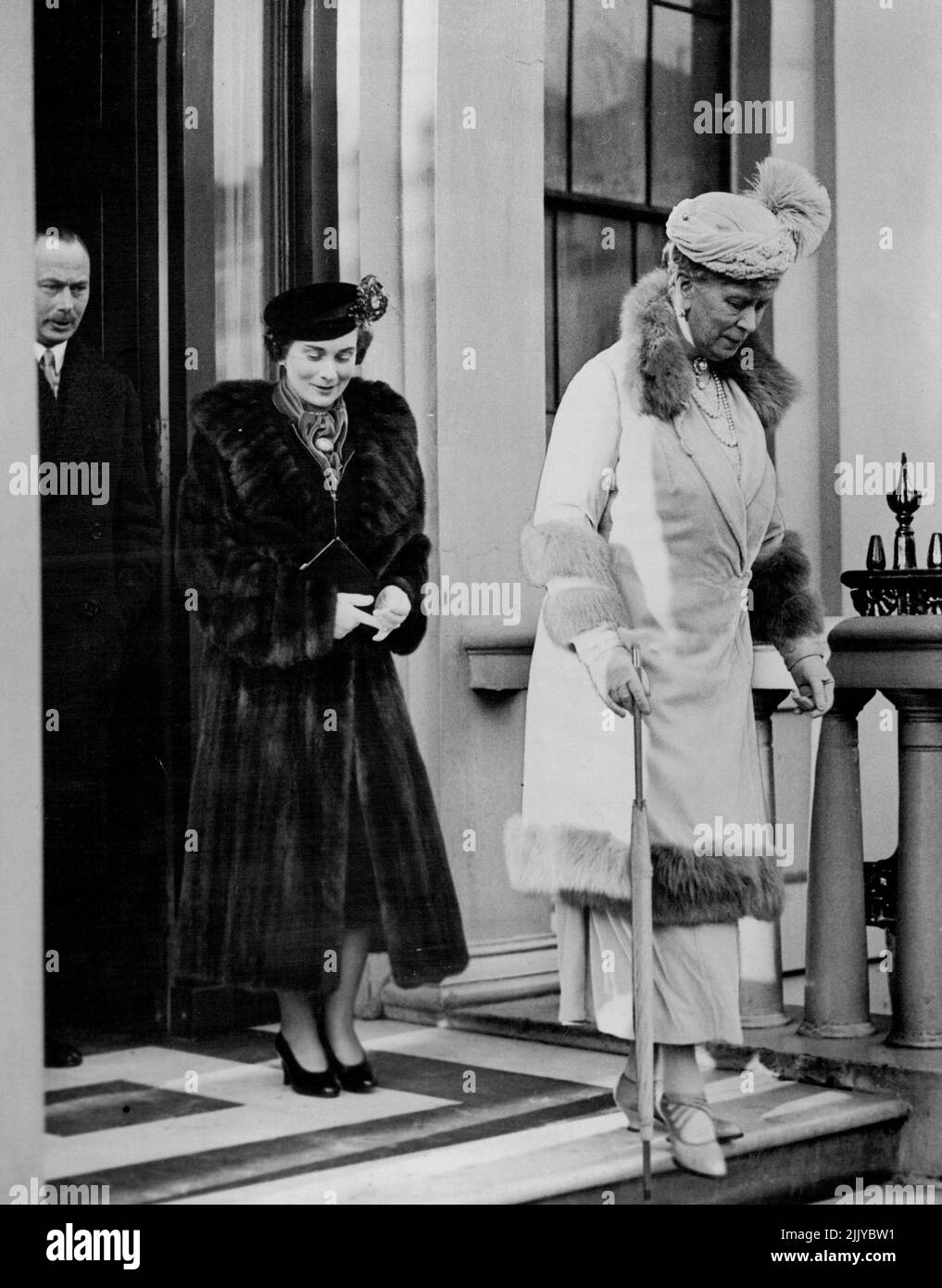 Christening Of Infant ***** -- Queen Mary, followed by the Duke and Duchess of Gloucester, leaving the home of the Duke and Duchess of Kent in Belgrave Square, London, S.W., for Buckingham Palace. ***** Christening of the infant daughter of Duke and Duchess of Kent took place to-day in the ***** chapel at Buckingham Palace, London, S.W. The ceremony was attended by the King and Queen, Queen Mary and other members of the Royal family. February 09, 1937. (Photo by Topical Press). Stock Photo