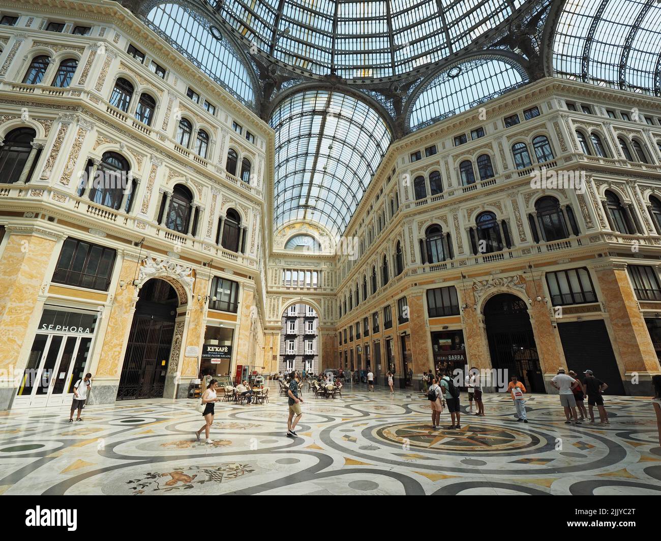 People shopping in the grand Galleria Umberto 1 shopping mall in the city center of Naples, Campania, Italy Stock Photo