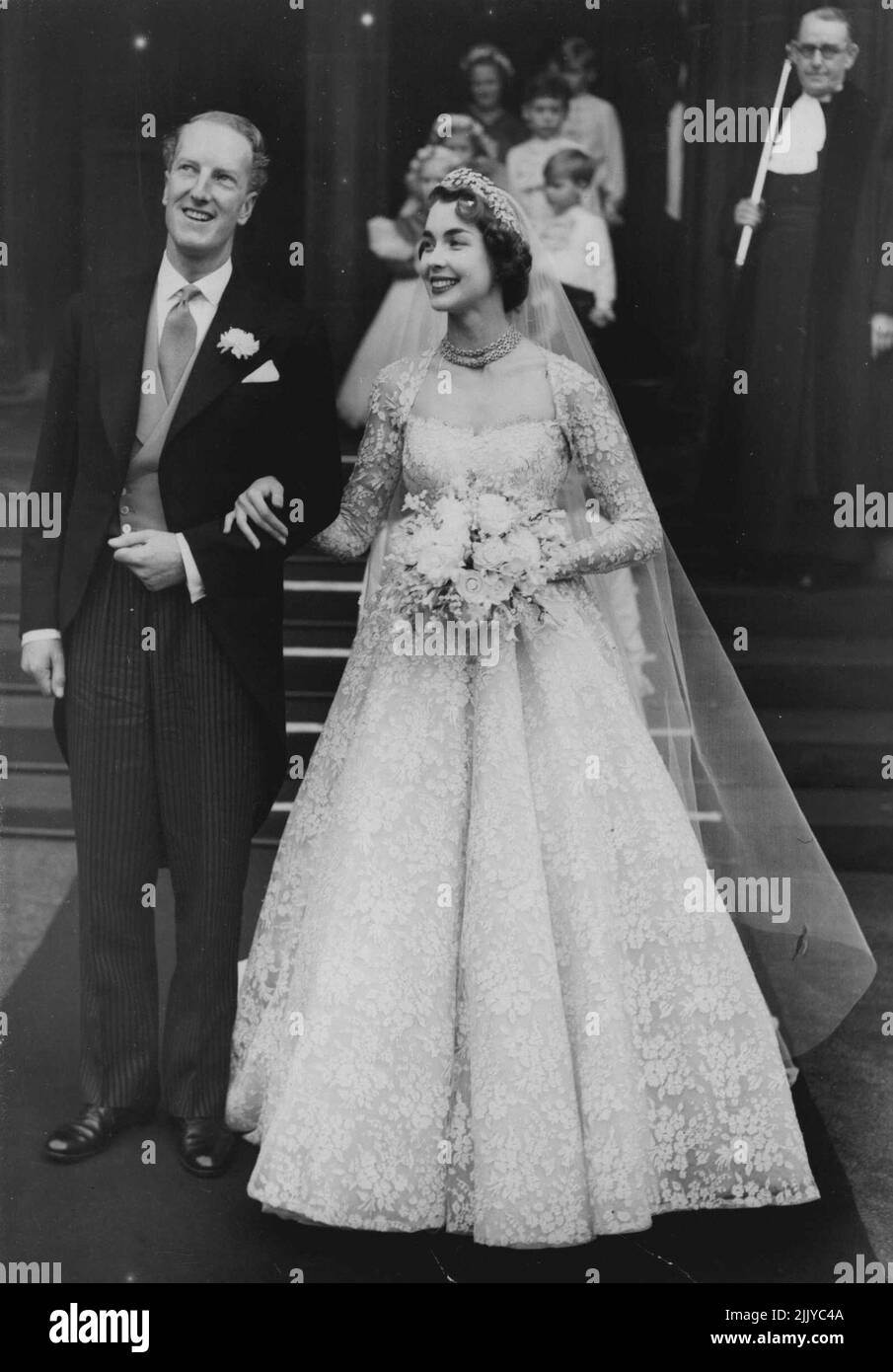 The Earl and his Bride:- The Earl of Dalkeith, 29, and his radiant bride, 22 - year - old Miss Jane McNeill, a former mannequin and daughter of Mr.John McNeill, Queen's Counsel, leave St.Giles' Cathedral after their wedding. The Queen, Duke of Edinburgh, Princess Margaret, and other members of the royal family were among the guests. The Earl is heir to the eight - county estates of the Duke of Buccleuch. The Dukedom dates back to 1663. January 11, 1953. Stock Photo