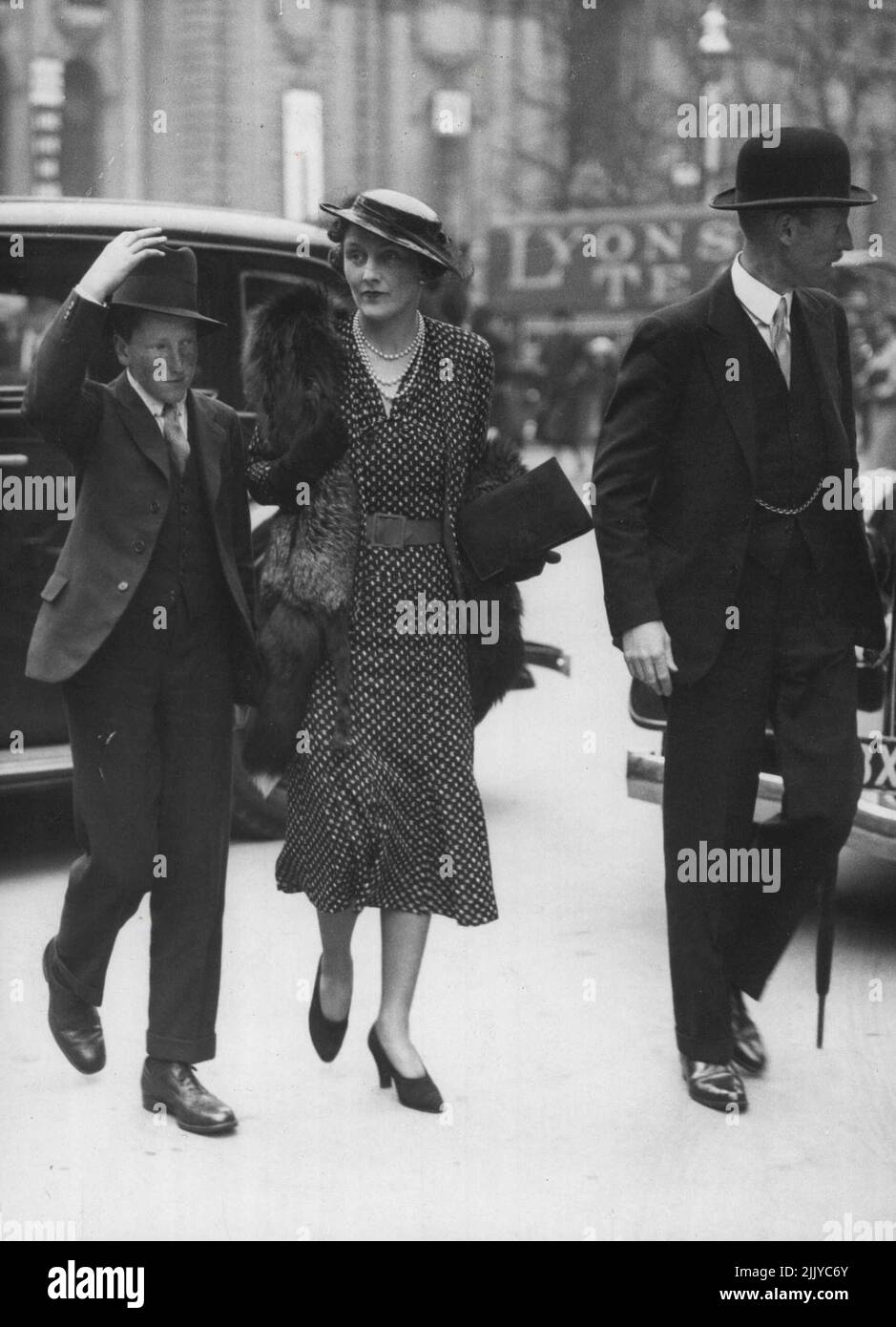 Photo Shows:-? The Duke and Duchess of Buccleuch and Lord Dalkeith leaving the Abbey. Duke and Duchess of Buccleuch at Coronation Rehersal. The Duke and Dichess of Buccleuch, accompanied by their son, Lord Dalkeith, attended the Coronation rehearsal at Westminster Abbey. May 6, 1937. Stock Photo