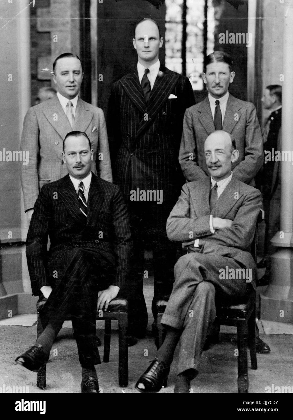 Left Prince (seated left) with his Chief of staff (Mayor-General Howard-Myse) standing (from left) Capt Howard Kerr equaling Capt Derek Schreiber second equally & Captain Arthur Curtis, Private Secretary.October 8, 1934. Stock Photo
