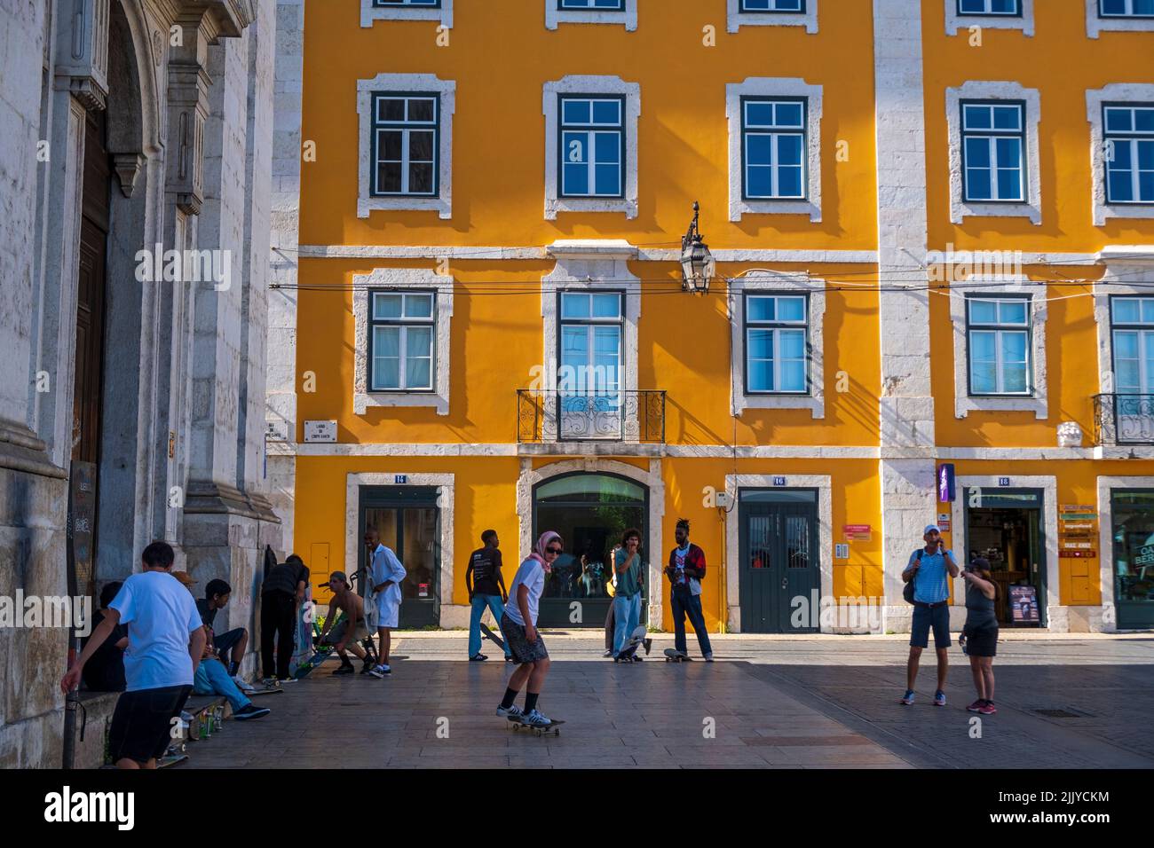Skateboarders in a square in the historic center of Lisbon, Portugal Stock Photo
