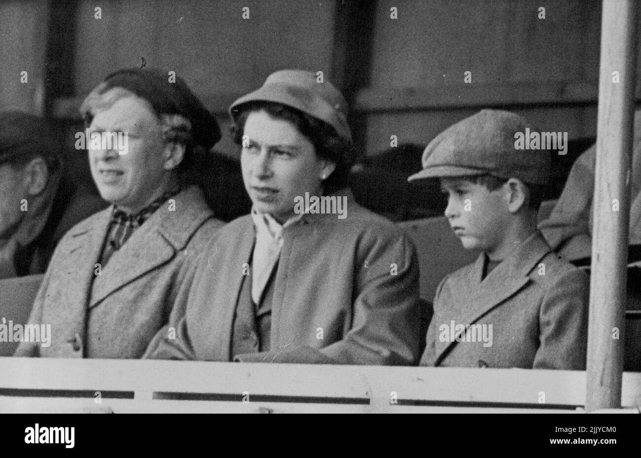 Royal Visitors To The European Horse Trials -- L to R: The Princess Royal; H.M. Queen Elizabeth; and Prince Charles watching the Dressage tests on the 1st day. Many of the world's finest horses and riders - men and women - can be seen in action at the Four day European Horse Trials opened in Windsor Great Park. May 19, 1955. (Photo by Sport & General Press Agency, Limited). Stock Photo