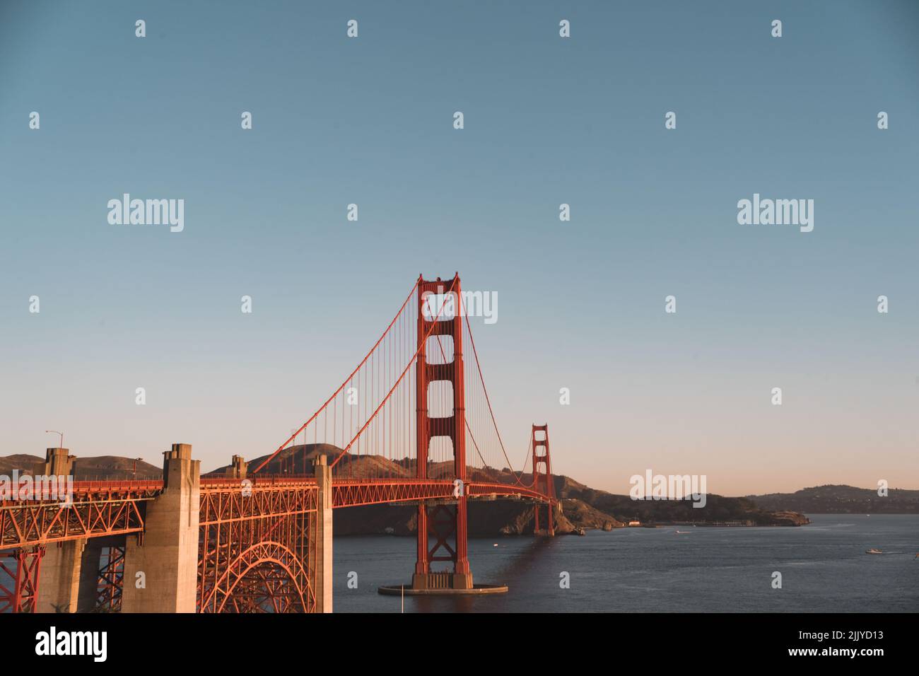 a View of the Golden Gate Bridge during sunrise in San Francisco, USA ...