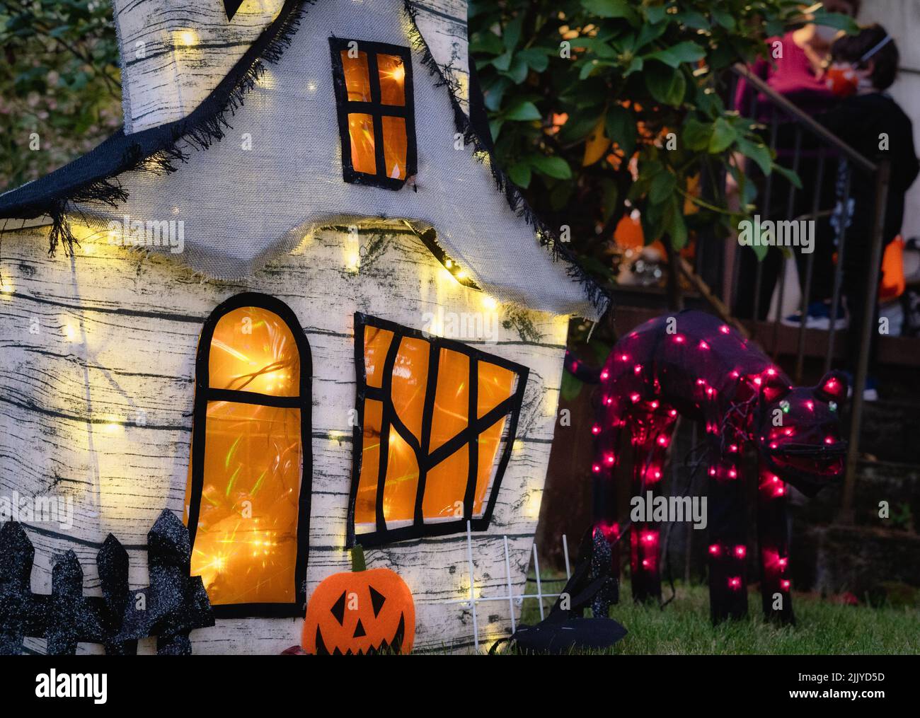 Halloween decorations consisting of a haunted house and lights Stock ...